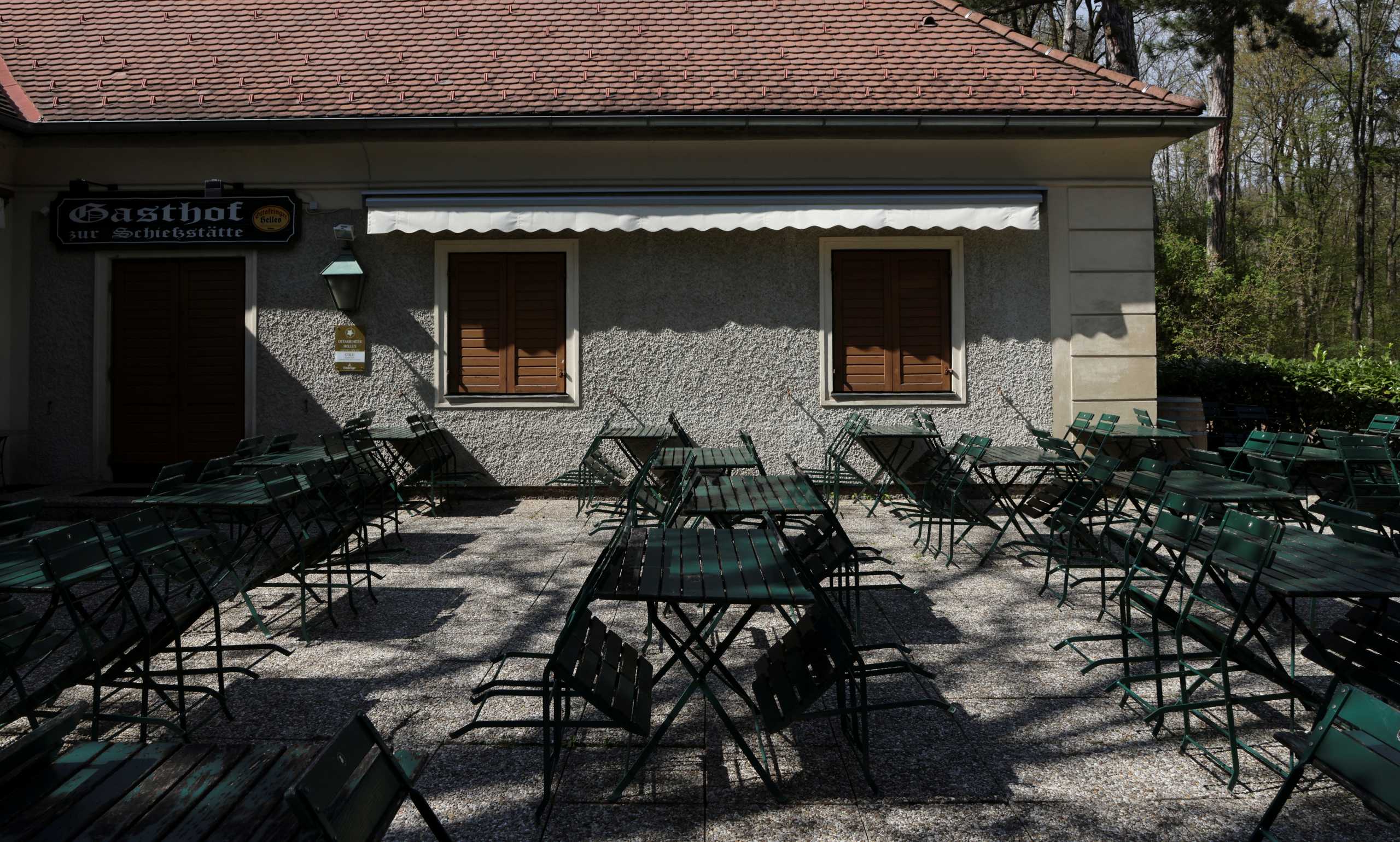 Tables and chairs are pictured next to a closed restaurant as the coronavirus disease (COVID-19) lockdown continues in Vienna, Austria April 23, 2021. REUTERS