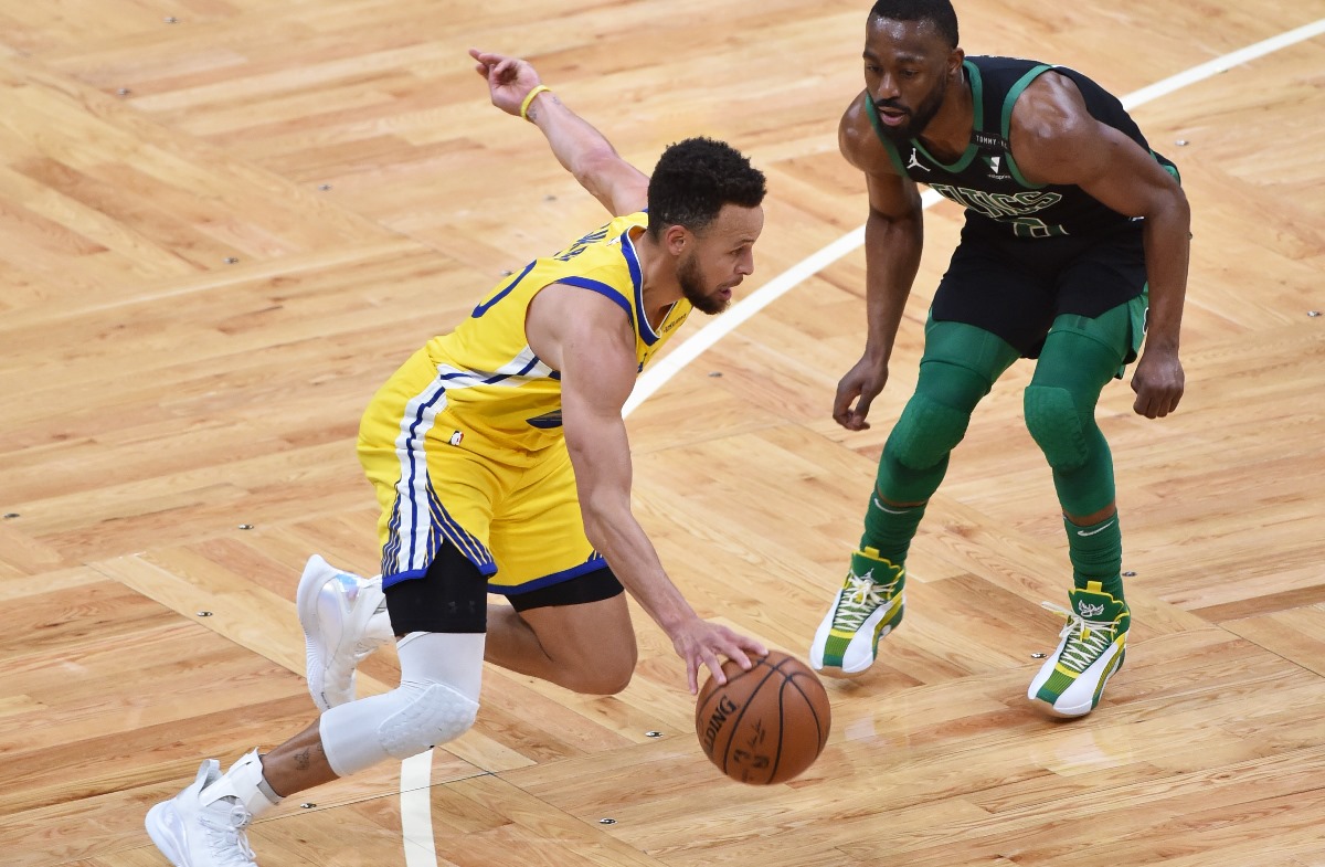 Apr 17, 2021; Boston, Massachusetts, USA; Golden State Warriors guard Stephen Curry (30) controls the ball while Boston Celtics guard Kemba Walker (8) defends during the first half at TD Garden. Mandatory Credit: Bob DeChiara-USA TODAY Sports