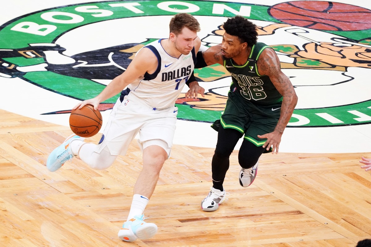 Mar 31, 2021; Boston, Massachusetts, USA; Dallas Mavericks guard Luka Doncic (77) drives the ball against Boston Celtics guard Marcus Smart (36) during the second quarter at TD Garden. Mandatory Credit: David Butler II-USA TODAY Sports