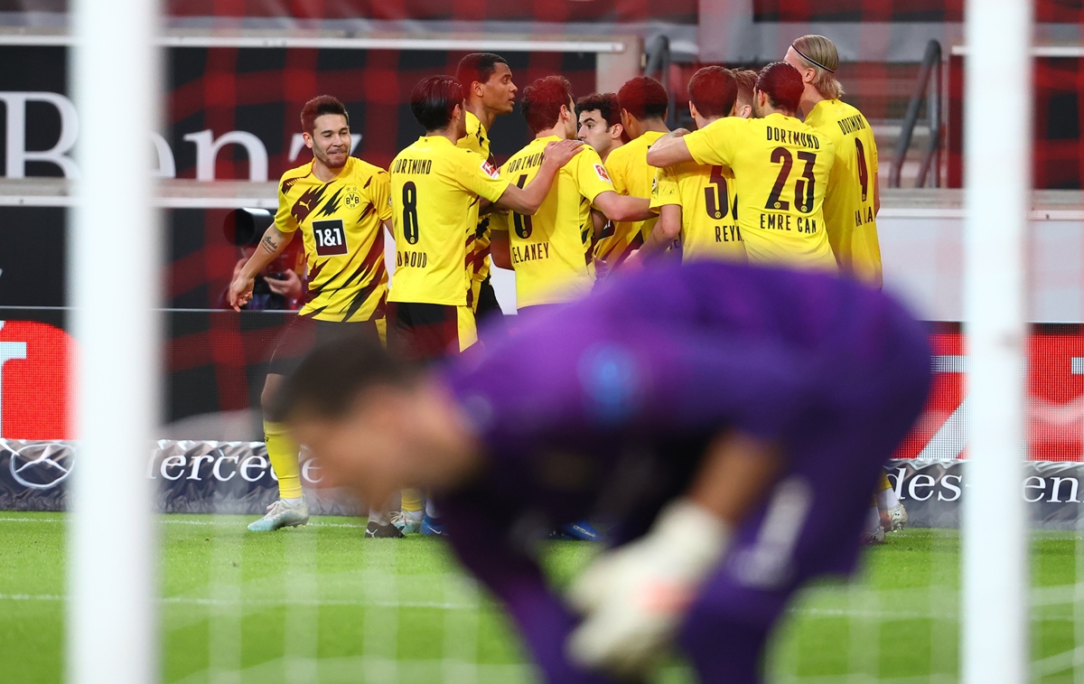 Soccer Football - Bundesliga - VfB Stuttgart v Borussia Dortmund - Mercedes-Benz Arena, Stuttgart, Germany - April 10, 2021 Borussia Dortmund's Marco Reus celebrates scoring their second goal with teammates Pool via REUTERS