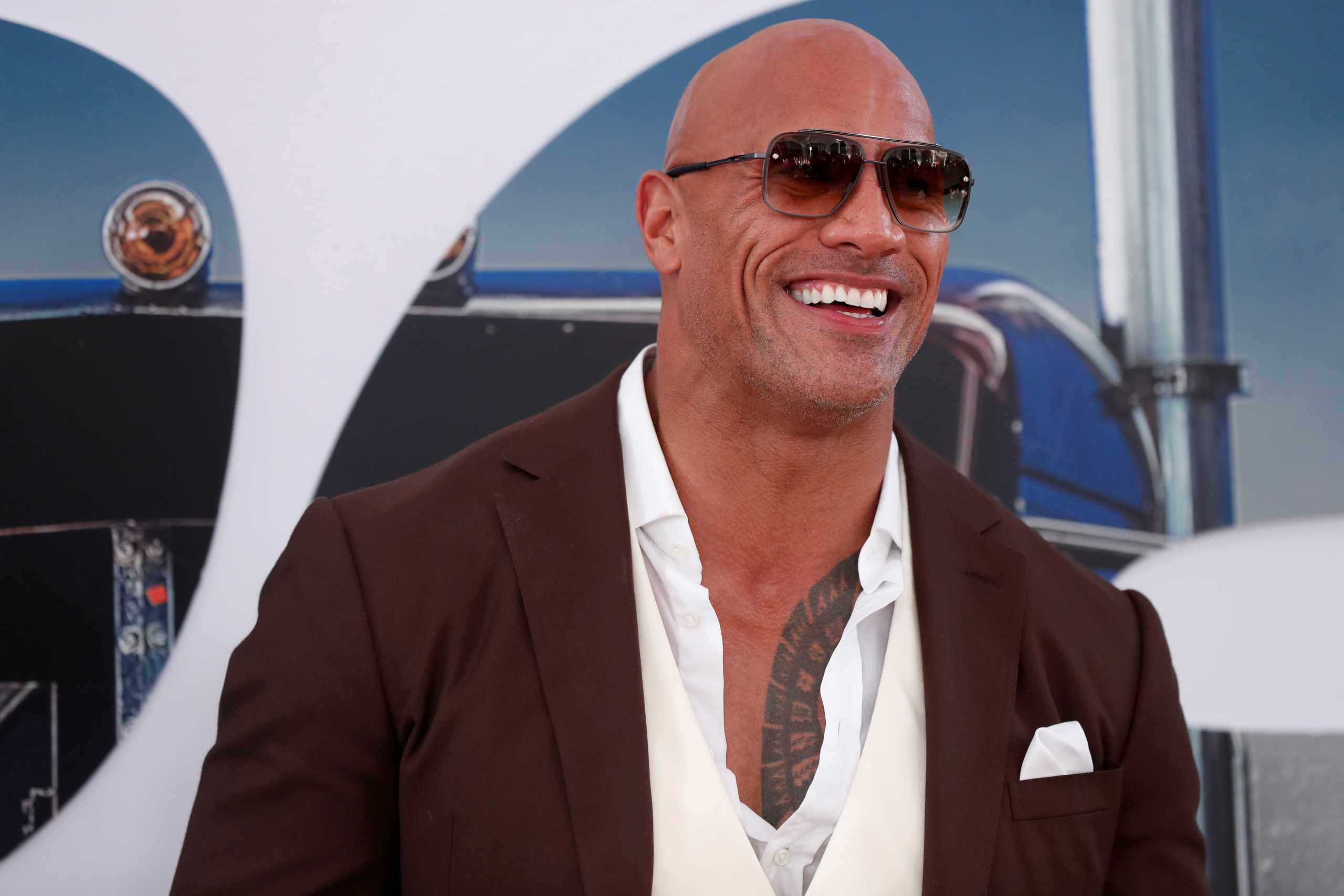 FILE PHOTO: Cast member and producer Dwayne Johnson poses at the premiere for "Fast & Furious Presents: Hobbs & Shaw" in Los Angeles, California, U.S., July 13, 2019. REUTERS