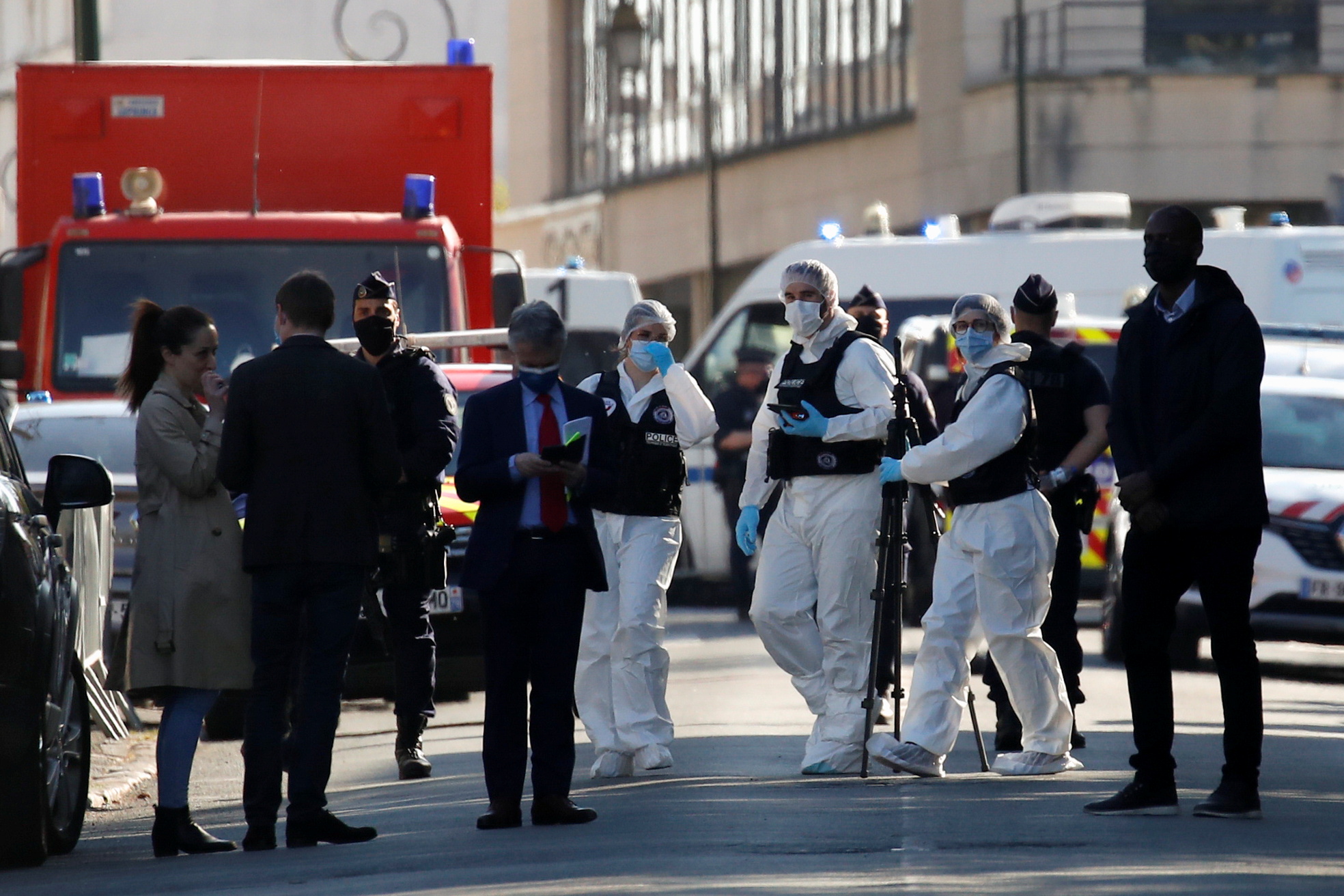 Police officers secure the area where an attacker stabbed a female police administrative worker, in Rambouillet, near Paris, France, April 23, 2021. REUTERS