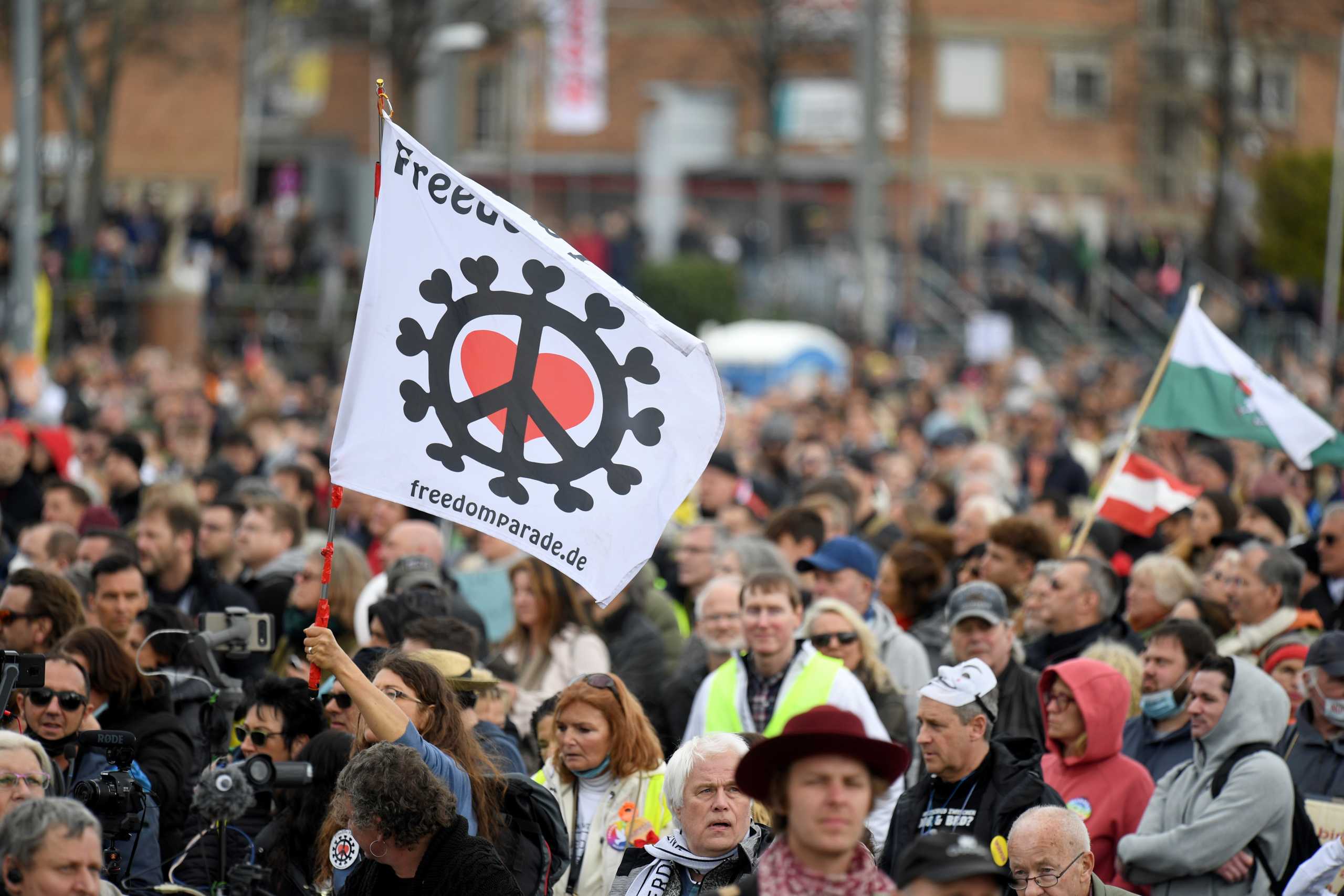 Demonstrators attend a protest against the government's coronavirus disease (COVID-19) restrictions in Stuttgart, Germany, April 3, 2021. REUTERS