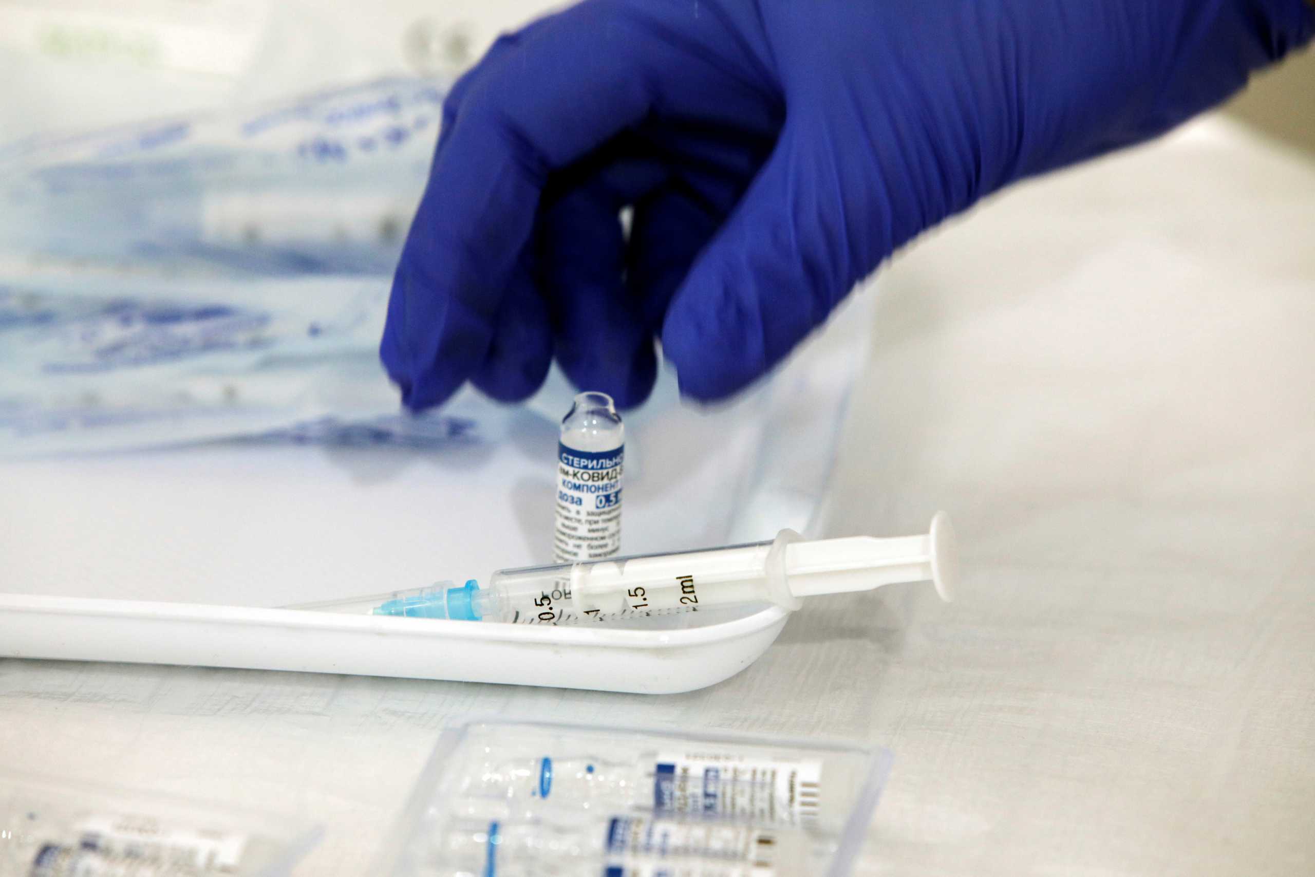 A nurse prepares a dose of Russia's Sputnik V coronavirus disease (COVID-19) vaccine at a sport centre, as the country starts mass inoculation campaign with the Russian vaccine donated by Serbia, in Skopje, North Macedonia April 5, 2021. REUTERS
