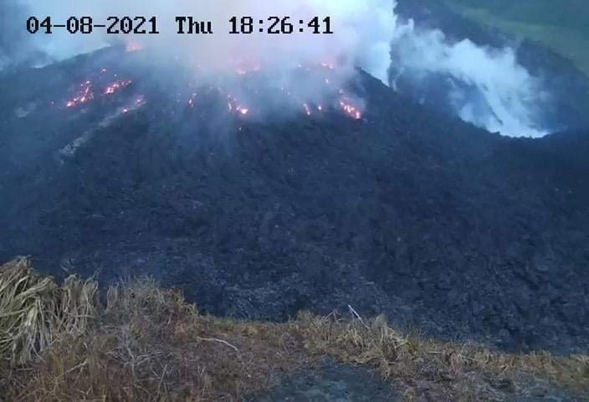 Smoke spews from the glowing dome of the La Soufriere volcano in Saint Vincent and the Grenadines, April 8, 2021, in this image obtained from the University of West Indies Seismic Research Center. Courtesy of The UWI Seismic Research Centre