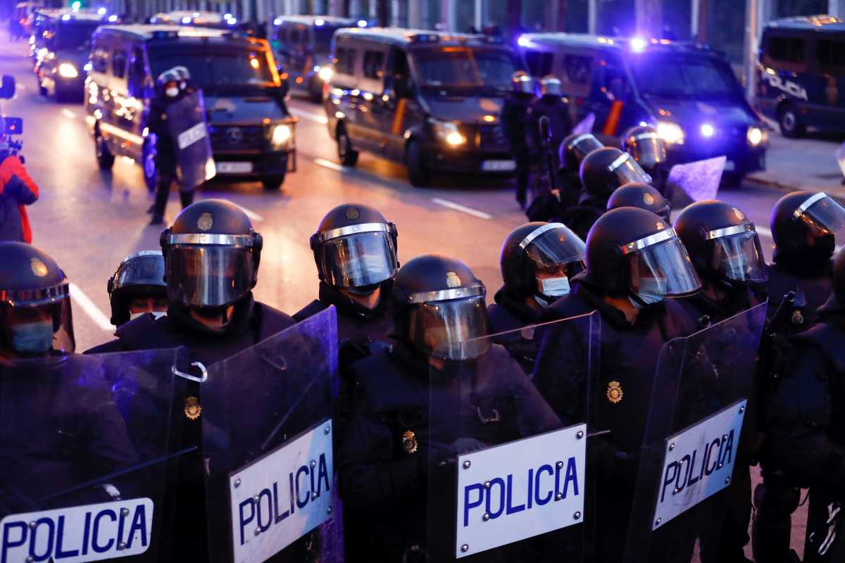 Police officers stand in formation during a protest in support of Catalan rap singer Pablo Hasel in Madrid, Spain, March 20, 2021. REUTERS