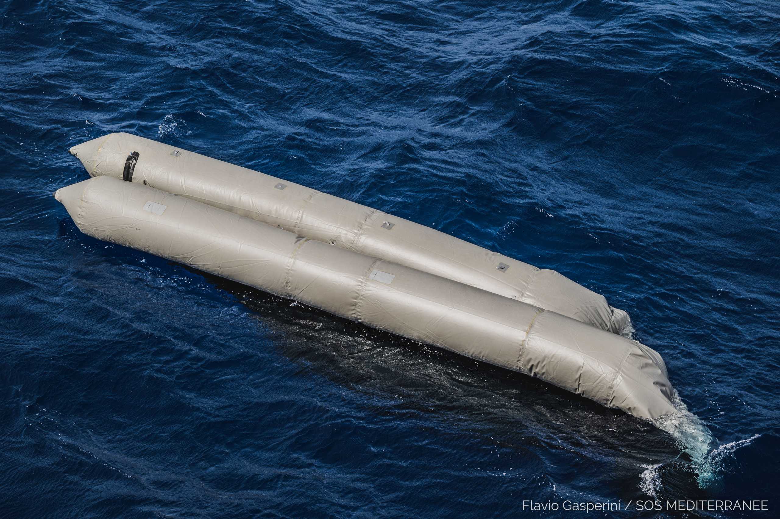 A rubber boat is seen after having capsized with more than 100 migrants on board, during a search and rescue (SAR) operation in the Mediterranean Sea, off the Libyan Coast, April 22, 2021. Picture taken April 22, 2021. Flavio Gasperini