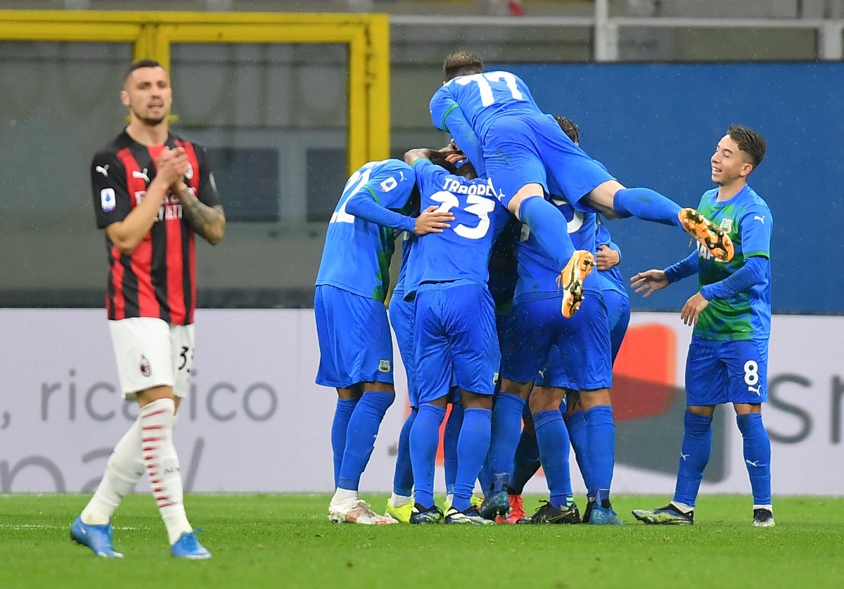 Soccer Football - Serie A - AC Milan v Sassuolo - San Siro, Milan, Italy - April 21, 2021 Sassuolo's Giacomo Raspadori celebrates scoring their second goal with teammates REUTERS