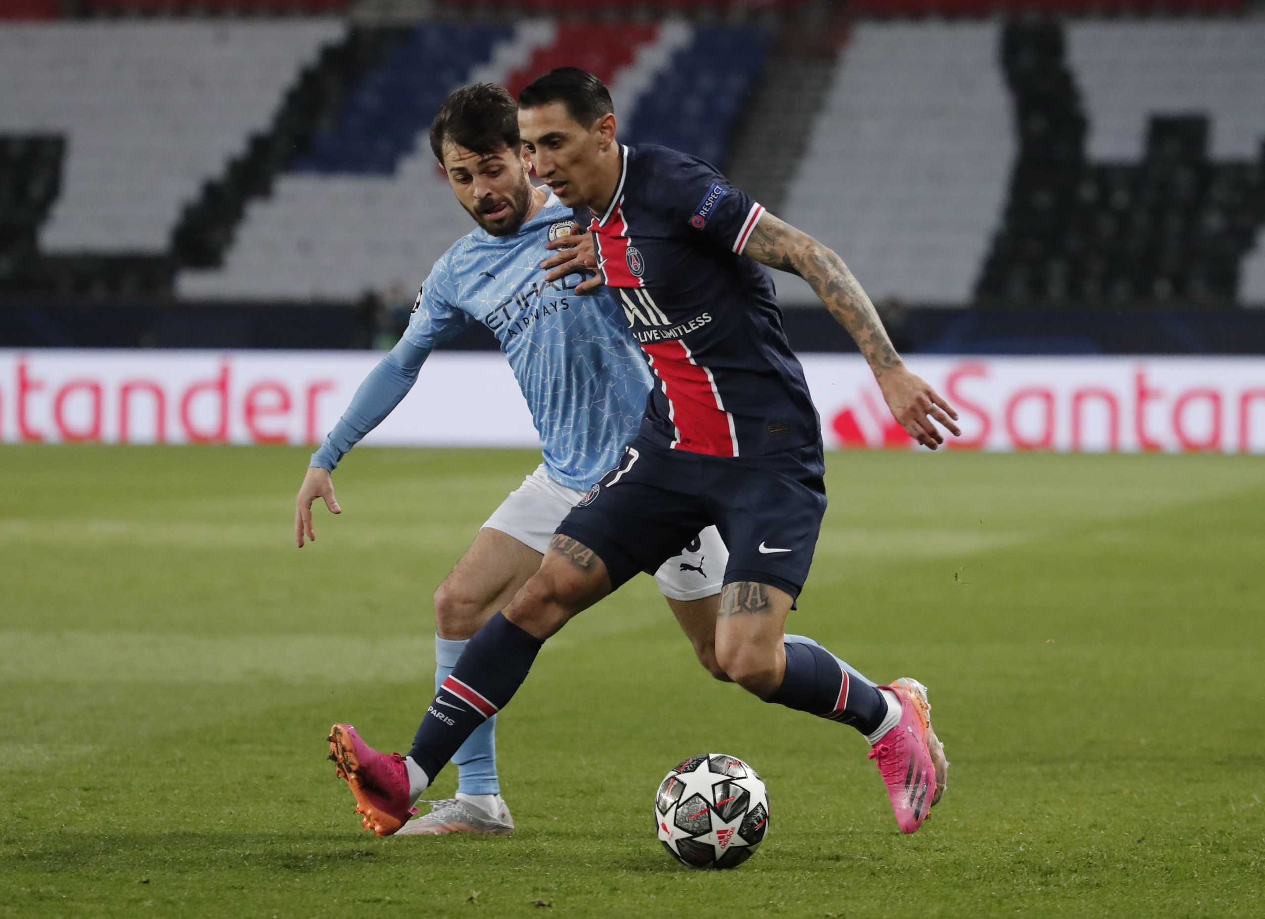 Soccer Football - Champions League - Semi Final First Leg - Paris St Germain v Manchester City - Parc des Princes, Paris, France - April 28, 2021 Manchester City's Bernardo Silva in action with Paris St Germain's Angel Di Maria REUTERS