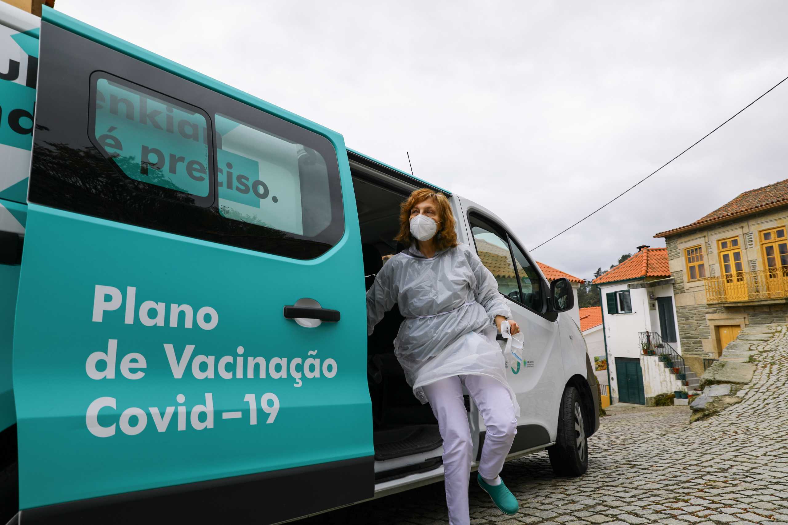 A medical worker gets off a van as they arrive to vaccinate people against the coronavirus disease (COVID-19) under an initiative by the Calouste Gulbenkian Foundation in Sabrosa, Portugal, April 9, 2021. REUTERS