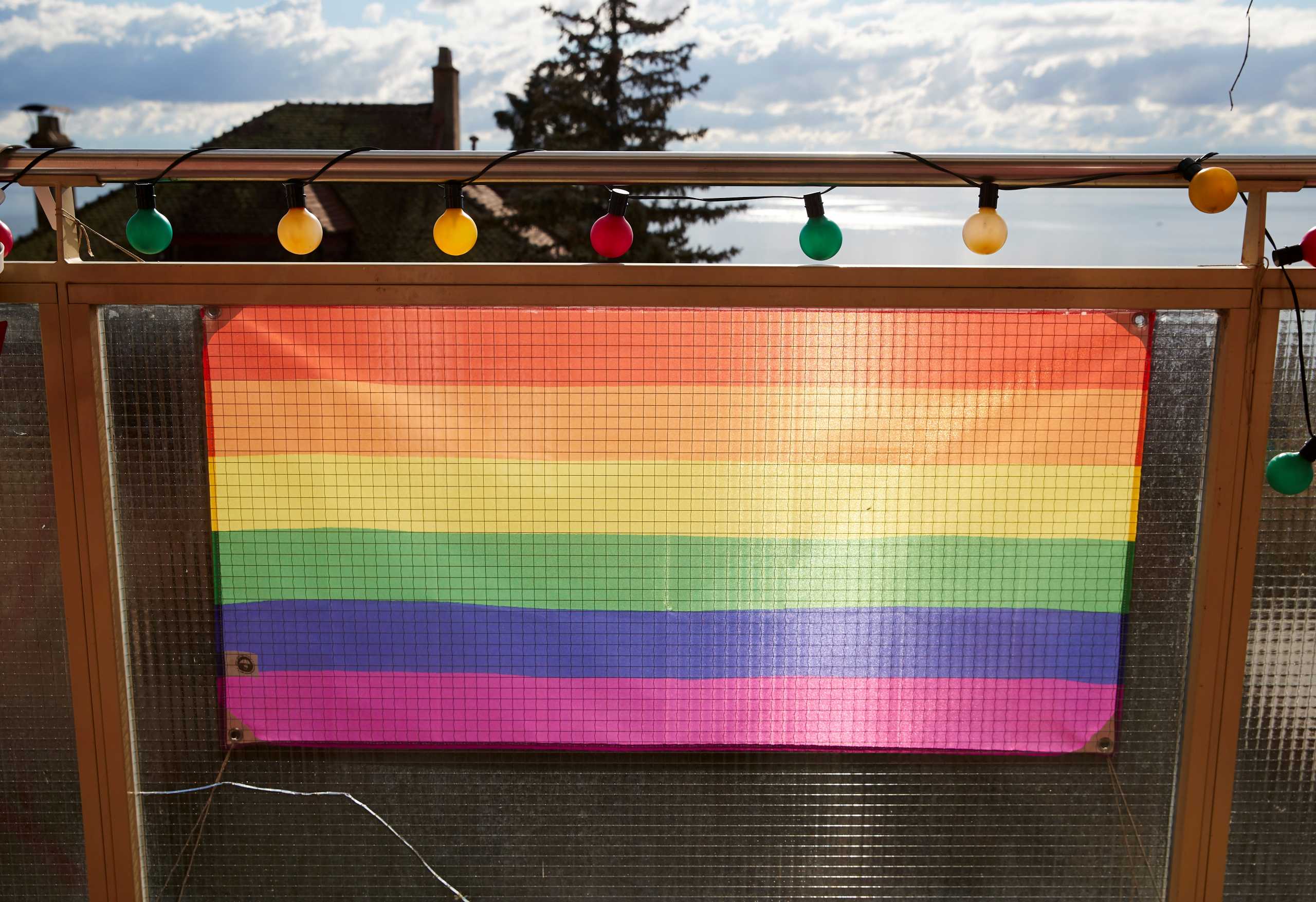 FILE PHOTO: A rainbow flag is pictured on a balcony ahead of a referendum on anti-homophobia law, in Neuchatel, Switzerland, February 5, 2020.   Picture taken February 5, 2020. REUTERS