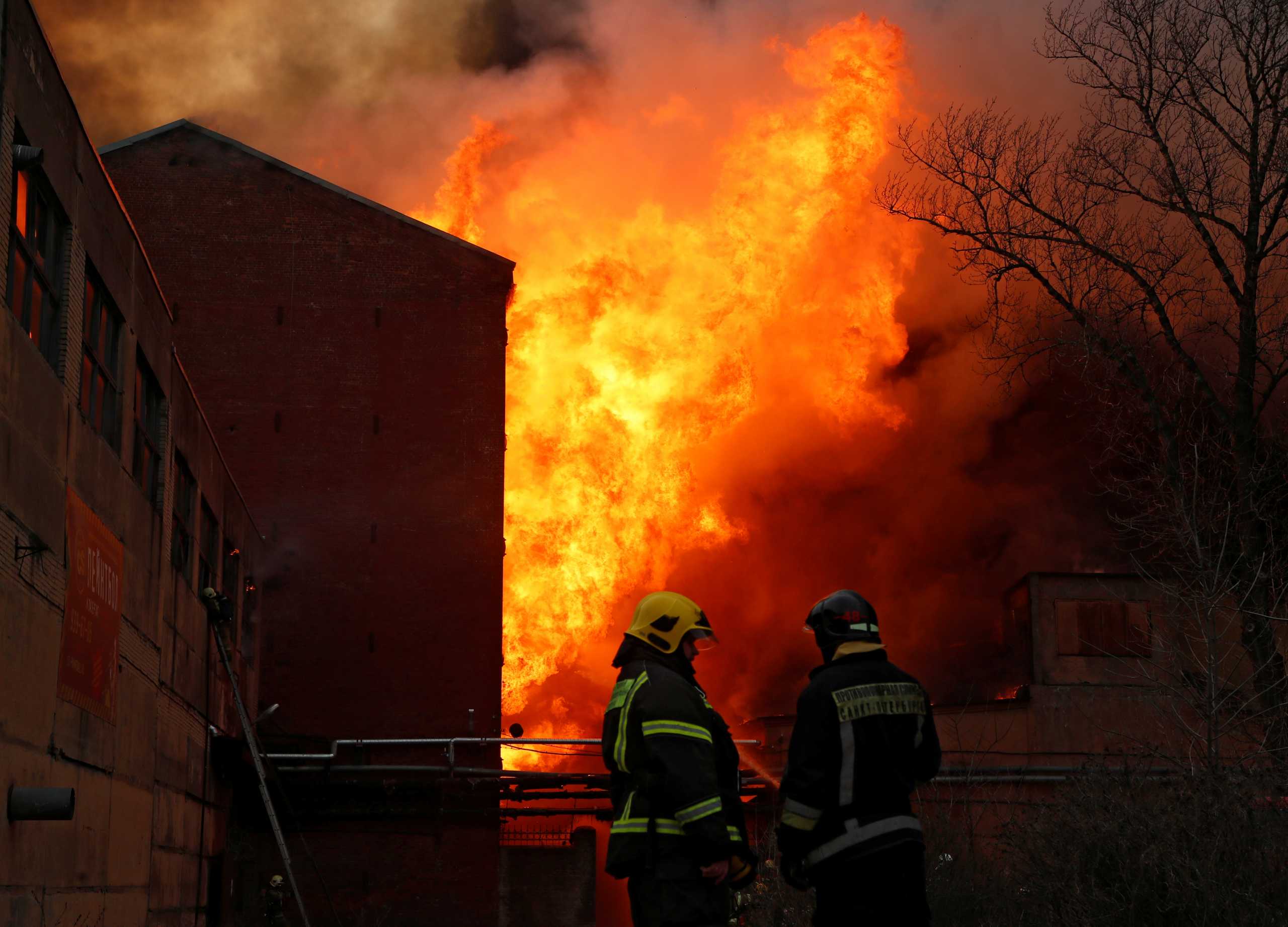 Firefighters work to extinguish a fire at the Nevskaya Manufaktura factory in central Saint Petersburg, Russia April 12, 2021. REUTERS