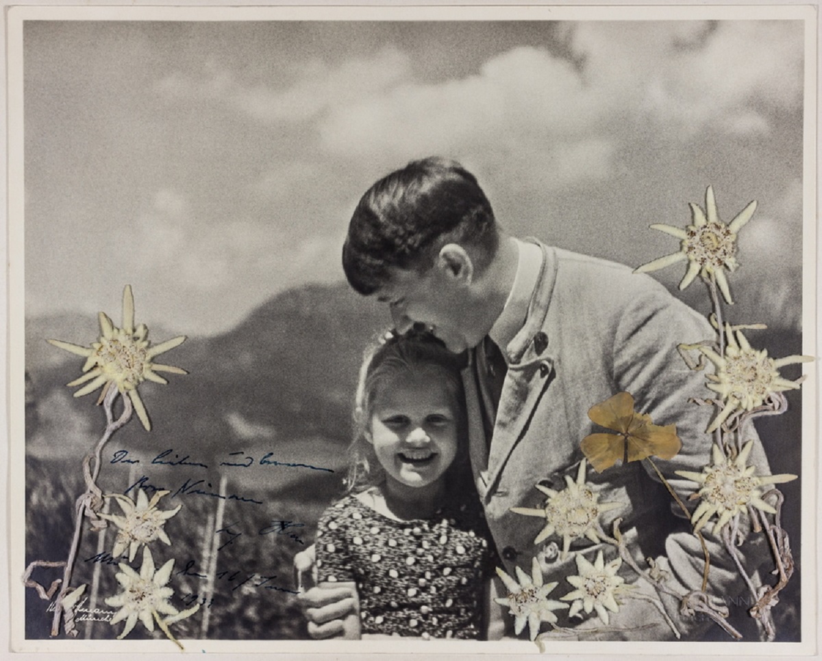 epa07165438 A handout photo made available by Alexander Historical Auctions shows an image by Adolf Hitler's official photographer Heinrich Hoffmann of German dictator Adolf Hitler and Rosa Nienau, then about five or six, at the Berghof and both celebrating their common birthday of April 20th. Rosa Bernile Nienau (1926–1943), called 'Bernile' and 'Rosa' by Hitler, became known as 'the Führer's child' or 'sweetheart' because of her close contact with Adolf Hitler. Soon after their introduction, it was discovered that the girl was one-quarter Jewish, yet Hitler refused to sever his relationship with her until years later. The picture was estimated between 7,500 and 10,000 US dollars but reached a final bid of 9,000 US dollars.  EPA