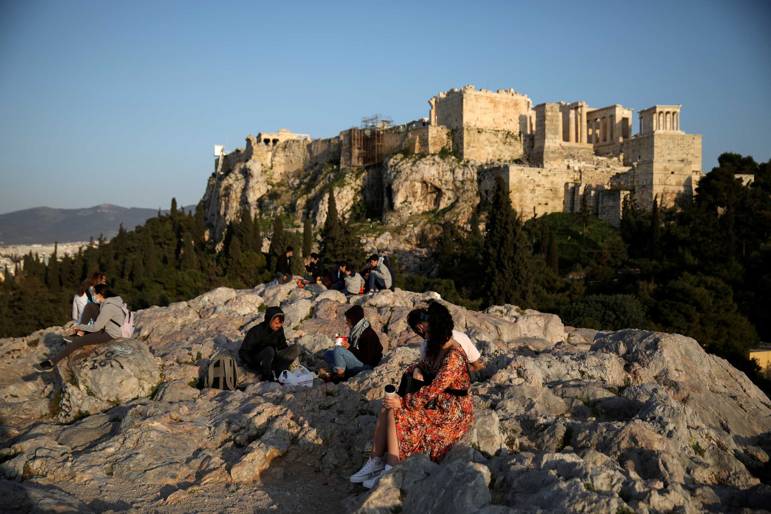 FILE PHOTO: Areios Pagos hill, with the Acropolis' Propylaea seen in the background, amid the coronavirus disease (COVID-19) pandemic, in Athens, Greece, March 10, 2021.  REUTERS