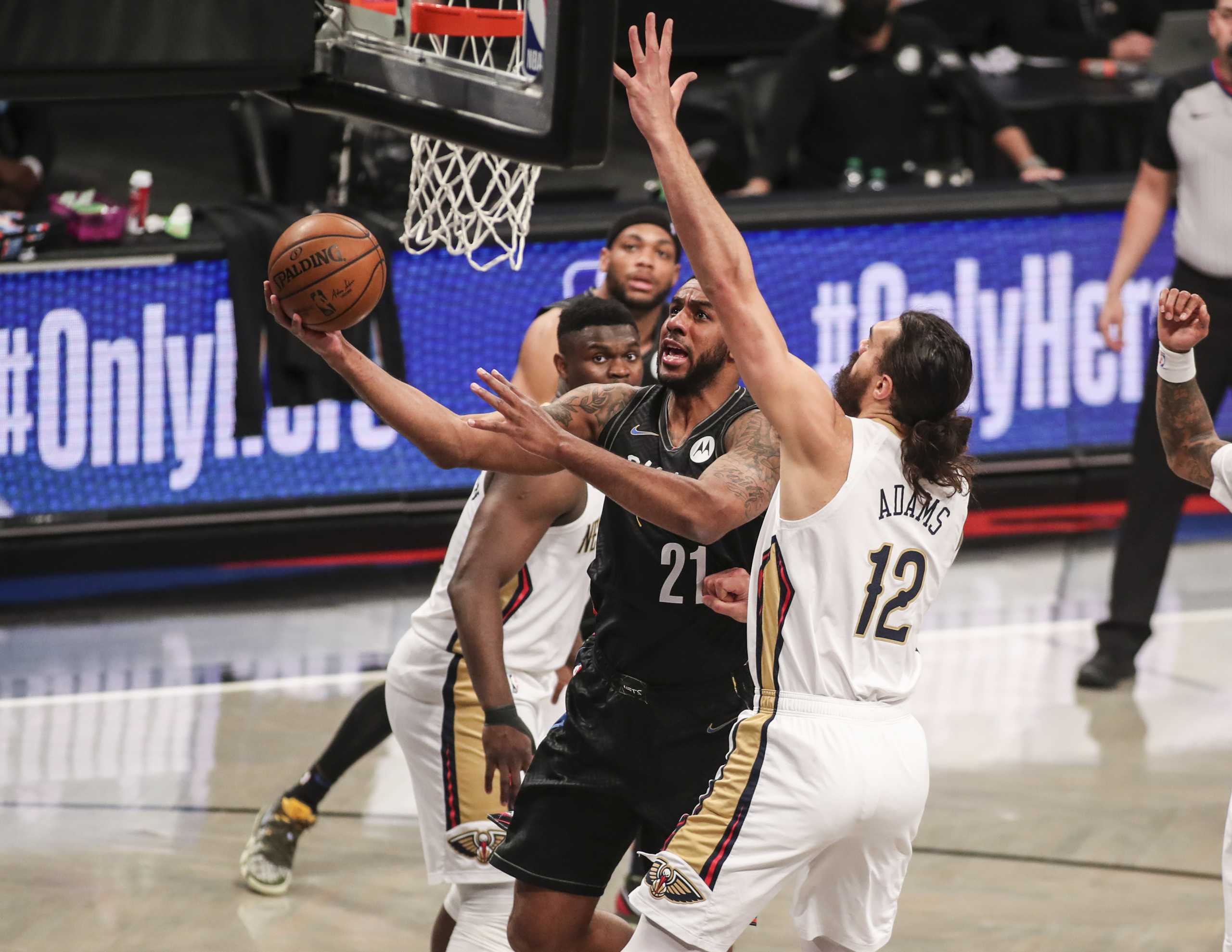 Apr 7, 2021; Brooklyn, New York, USA;  Brooklyn Nets center LaMarcus Aldridge (21) drives past New Orleans Pelicans center Steven Adams (12) in the first quarter at Barclays Center. Mandatory Credit: Wendell Cruz-USA TODAY Sports