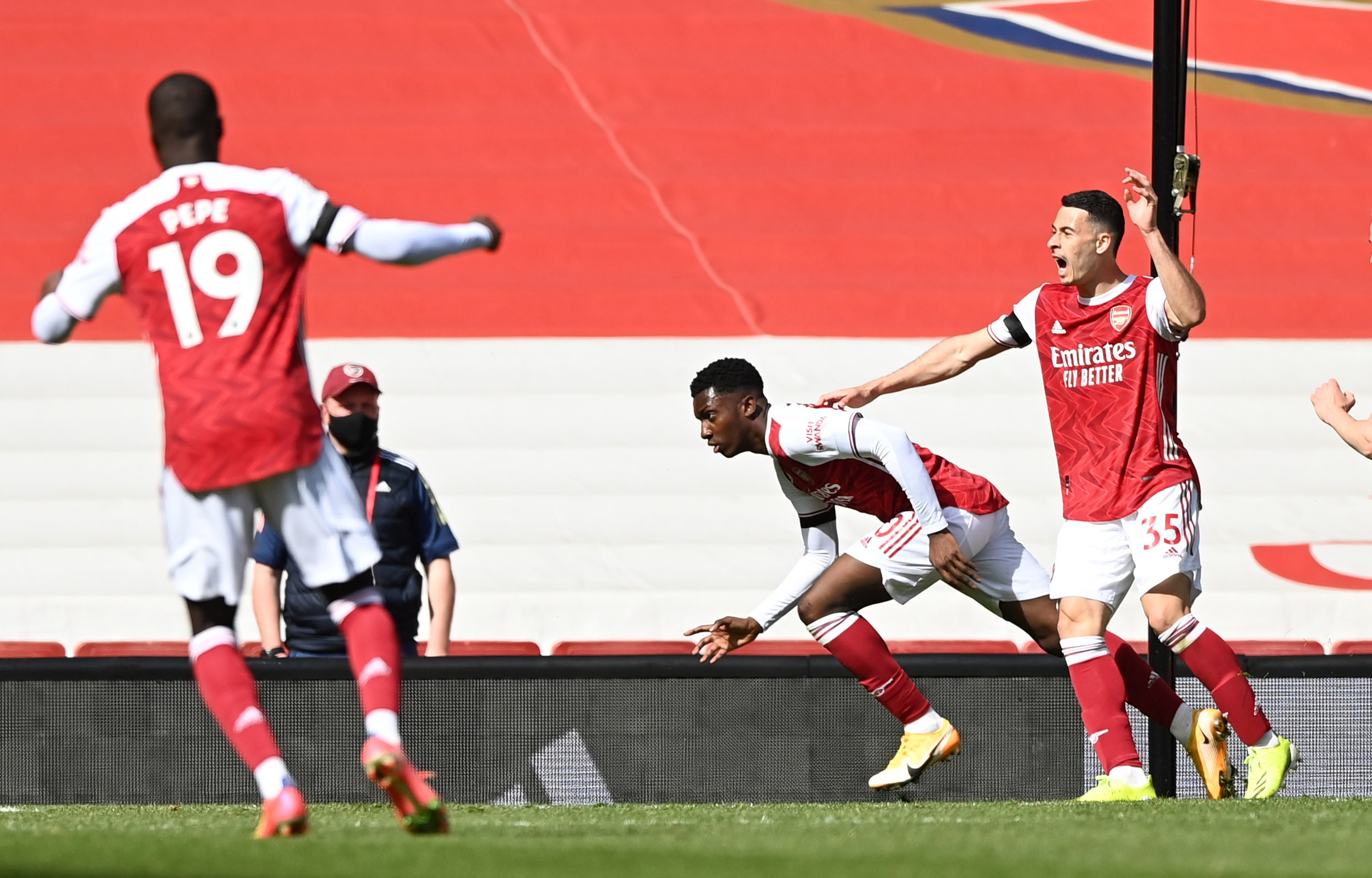 Soccer Football - Premier League - Arsenal v Fulham - Emirates Stadium, London, Britain - April 18, 2021 Arsenal's Eddie Nketiah celebrates scoring their first goal with teammates Pool via REUTERS