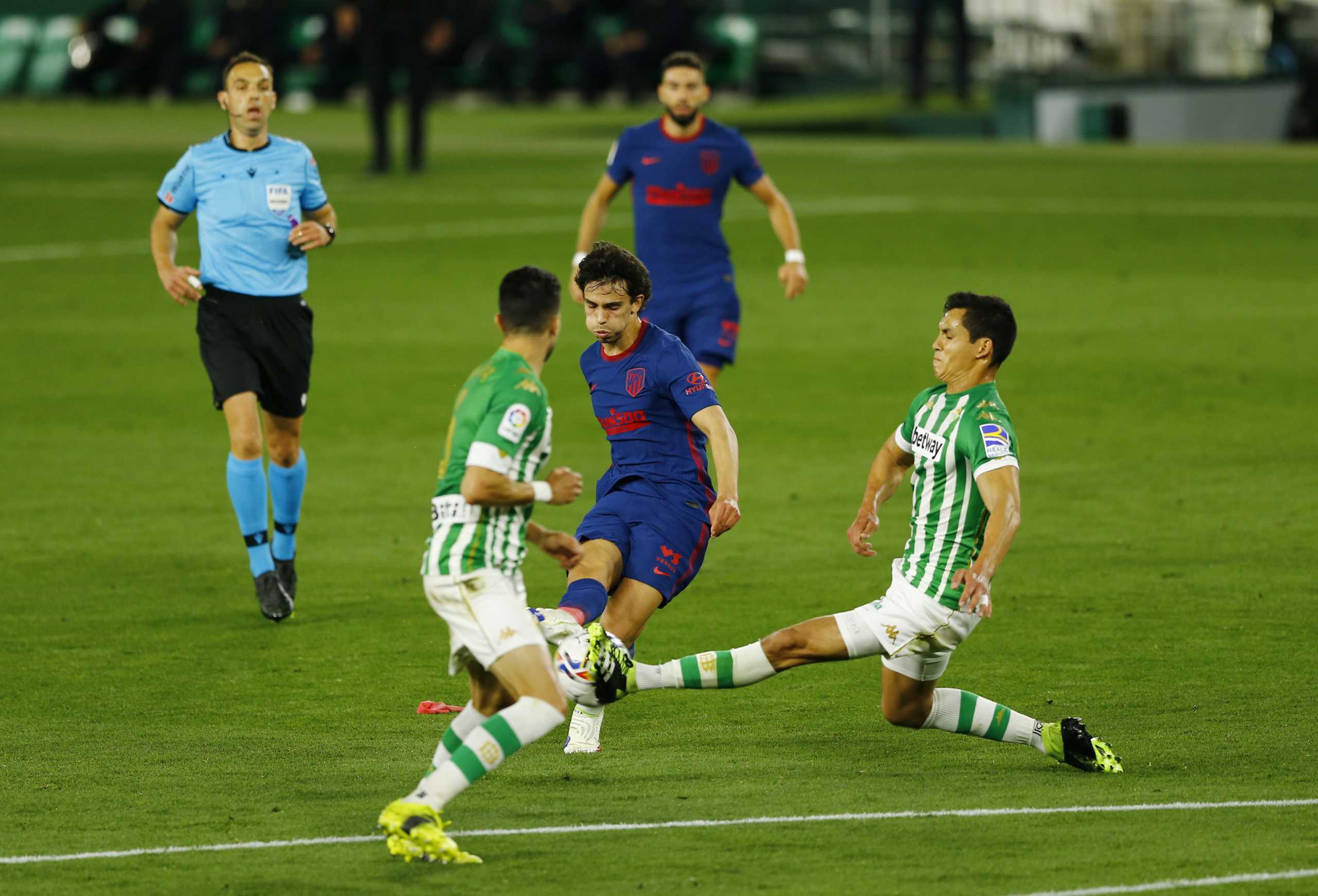 Soccer Football - La Liga Santander - Real Betis v Atletico Madrid - Estadio Benito Villamarin, Seville, Spain - April 11, 2021 Atletico Madrid's Joao Felix in action with Real Betis' Aissa Mandi REUTERS