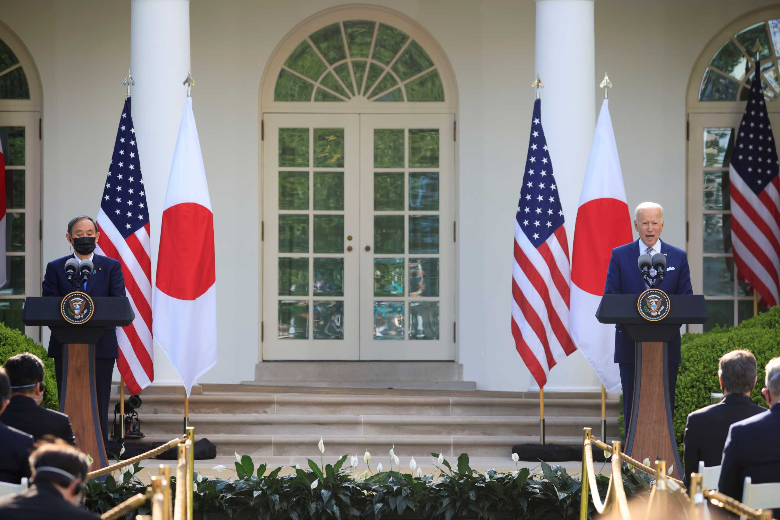 Japan's Prime Minister Yoshihide Suga and U.S. President Joe Biden hold a joint news conference in the Rose Garden at the White House in Washington, U.S., April 16, 2021. REUTERS