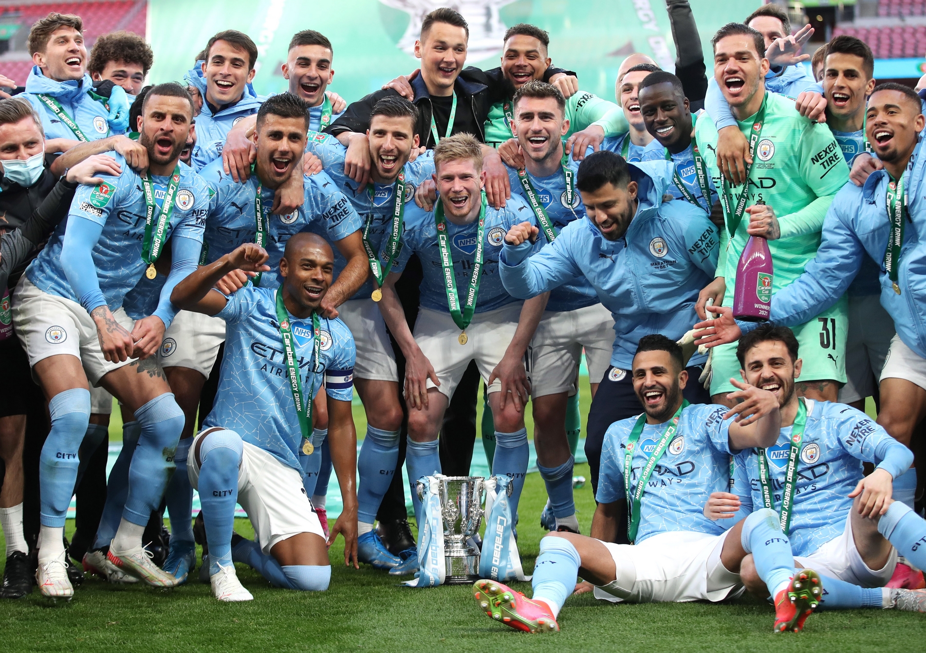 Soccer Football - Carabao Cup Final - Tottenham Hotspur v Manchester City - Wembley Stadium, London, Britain - April 25, 2021 Manchester City players pose with the trophy as they celebrate after winning the Carabao Cup Pool via REUTERS