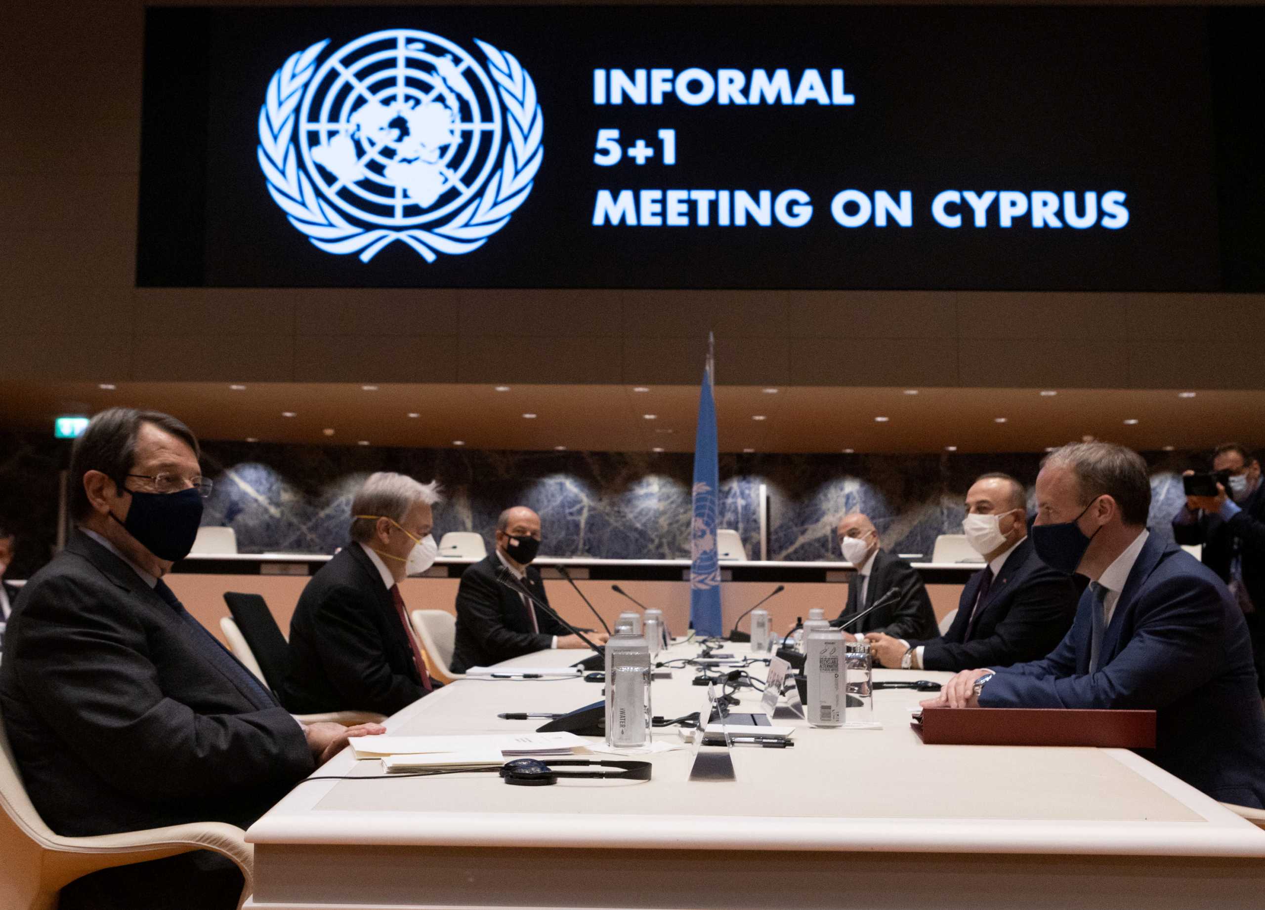United Nations Secretary-General Antonio Guterres, Cypriot President and Greek Cypriot leader Nicos Anastasiades, Turkish Cypriot leader Ersin Tatar, British Foreign Secretary Dominic Raab,Turkish Foreign Minister Mevlut Cavusoglu and Greece's Foreign Minister Nikos Dendias talk during a meeting at the United Nations European headquarters in Geneva, Switzerland April 29, 2021. Stavros Ioannides
