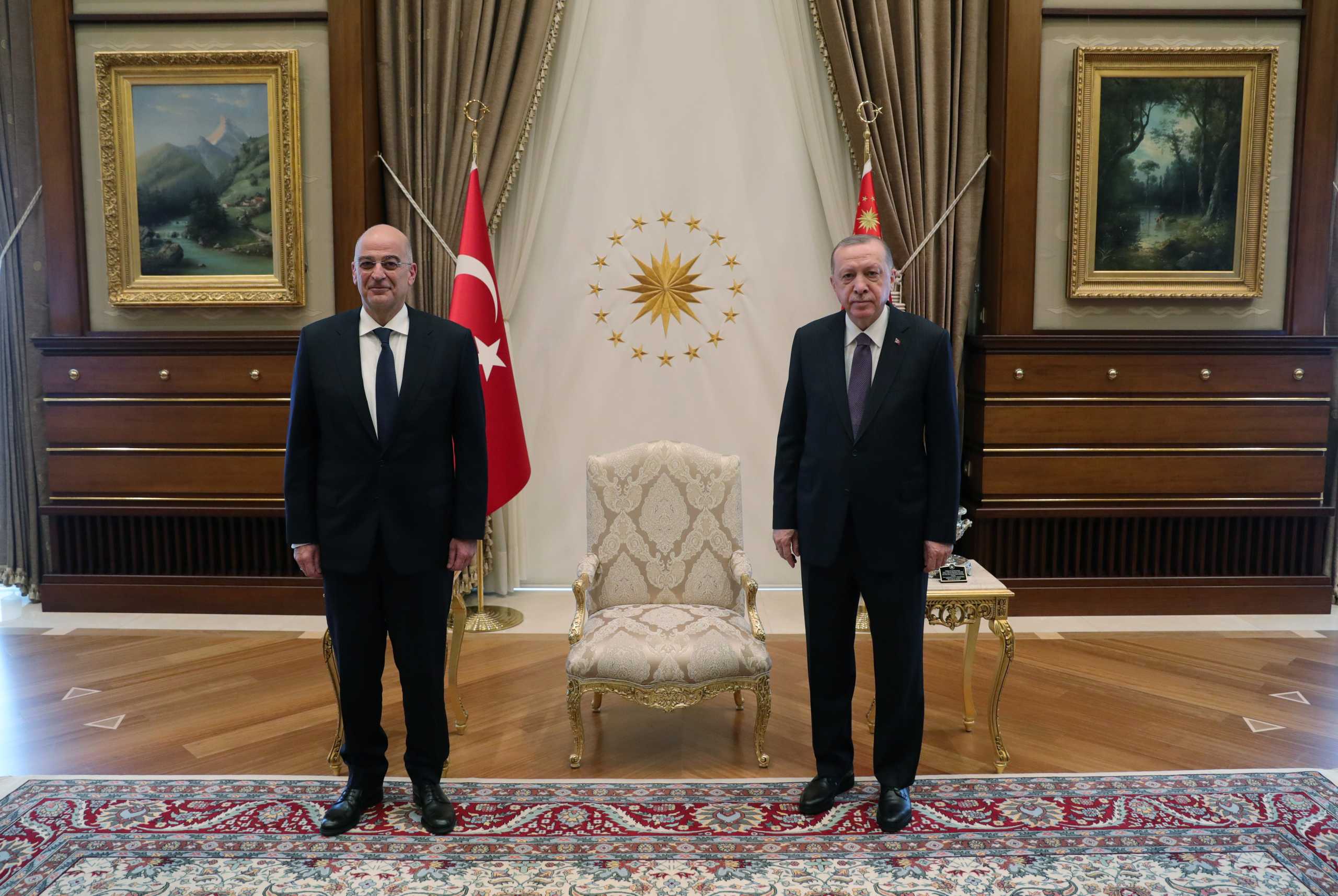 Turkish President Tayyip Erdogan meets with Greek Foreign Minister Nikos Dendias in Ankara, Turkey April 15, 2021. Presidential Press Office