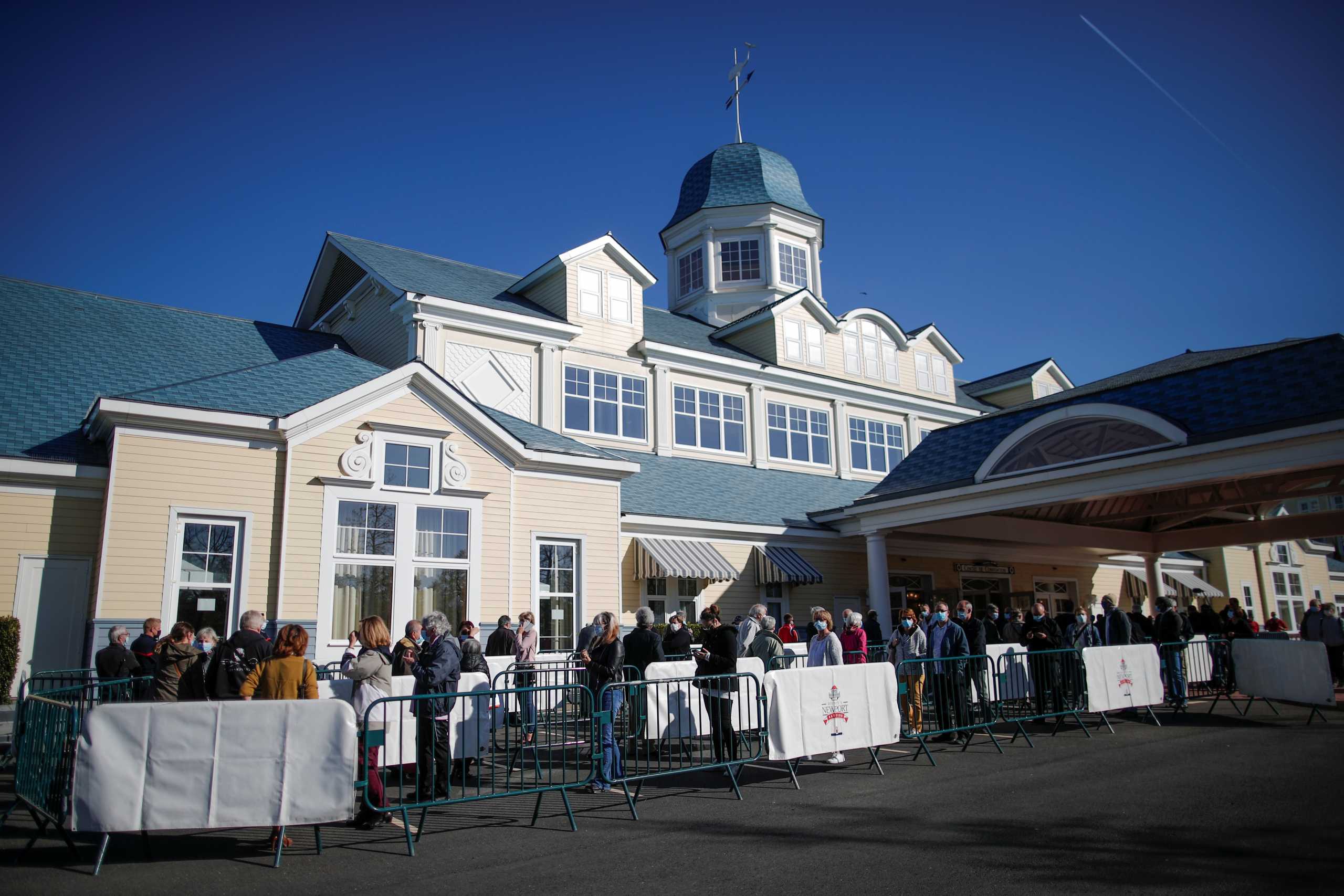 People line up at the Disneyland Paris theme park vaccination center in Marne-la-Vallee, near Paris, as part of the coronavirus disease (COVID-19) vaccination campaign in France, April 24, 2021. REUTERS