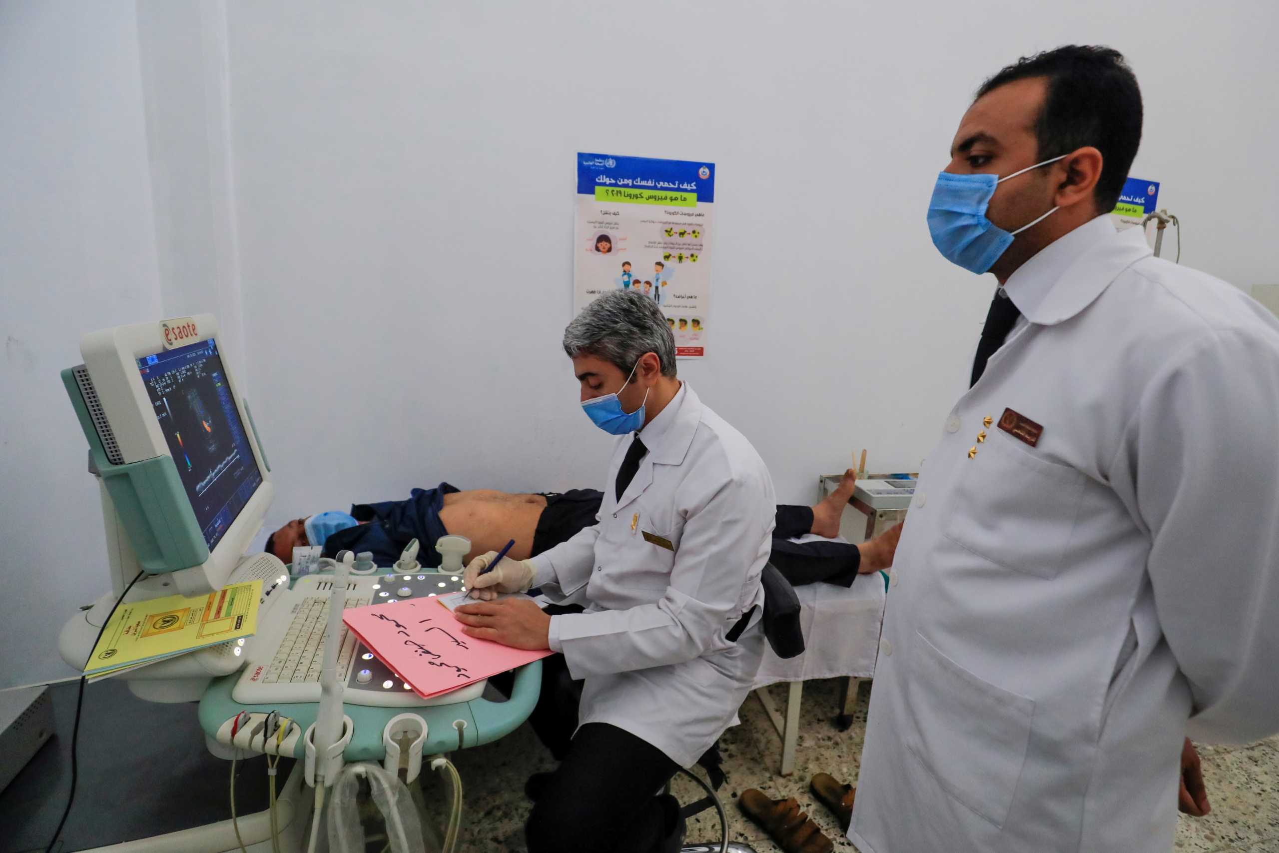 A healthcare worker examines an inmate during an official tour organised by the Egyptian State Information Service for the media, amid the outbreak of the coronavirus disease (COVID-19), at Borg el-Arab prison, near Alexandria, Egypt April 20, 2021. REUTERS