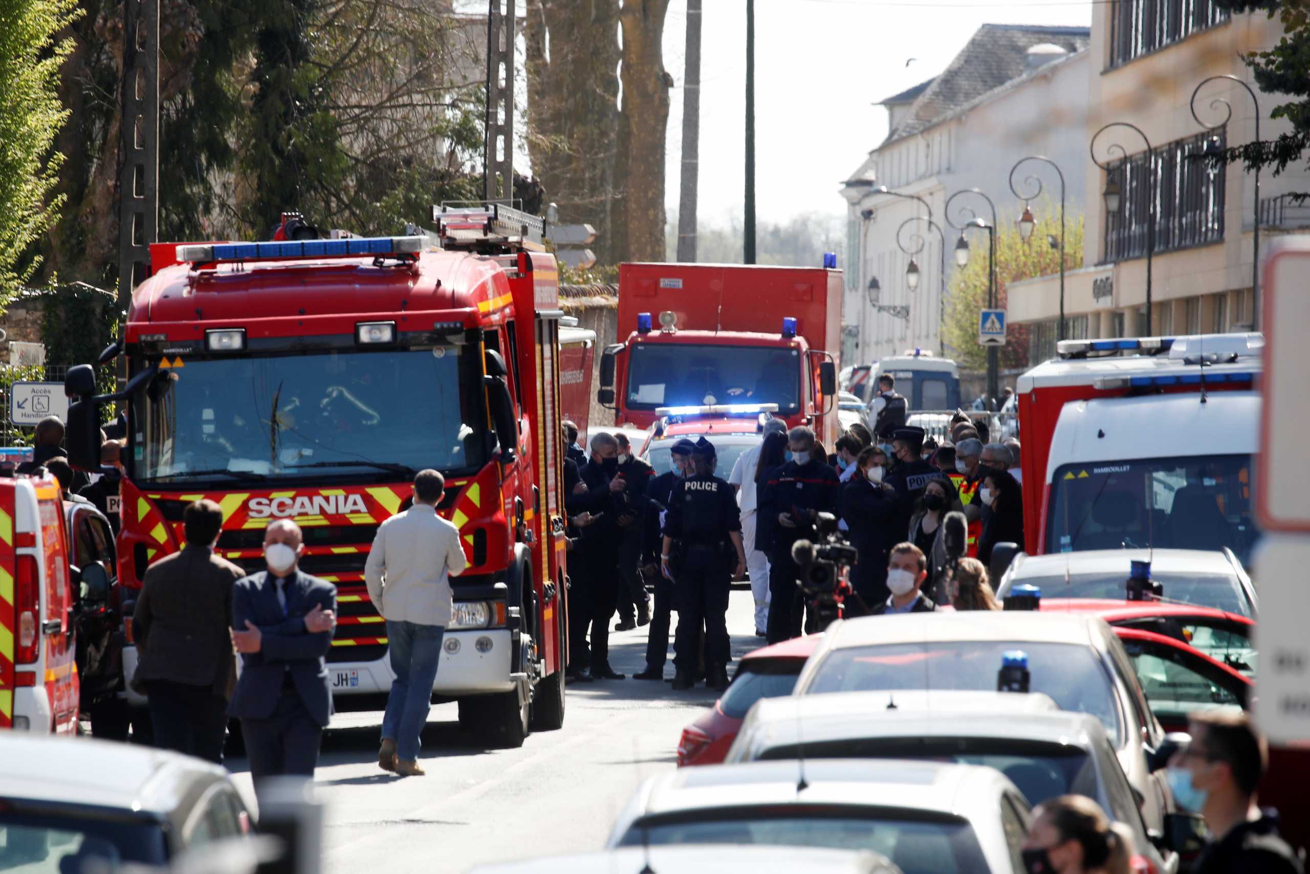 Police officers secure the area where an attacker stabbed a female police administrative worker, in Rambouillet, near Paris, France, April 23, 2021. REUTERS
