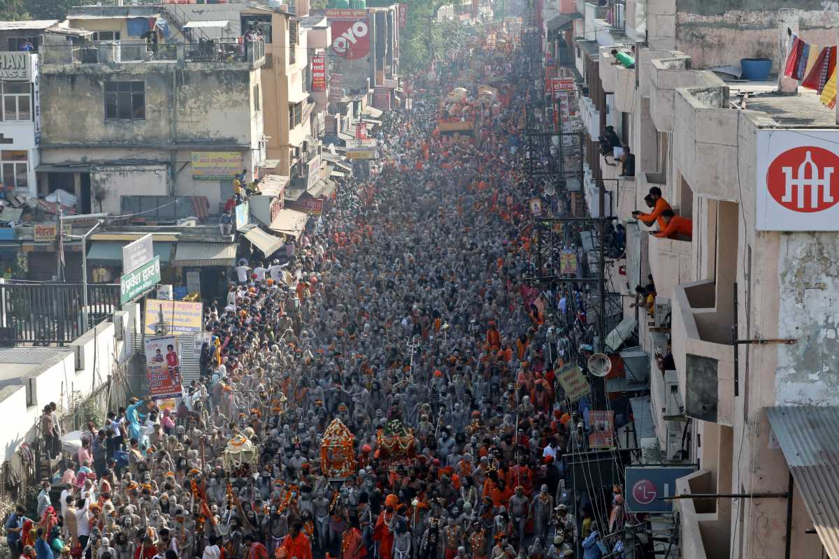 Naga Sadhus, or Hindu holy men participate in a procession to take a dip in the Ganges river during Shahi Snan at "Kumbh Mela", or the Pitcher Festival, amidst the spread of the coronavirus disease (COVID-19), in Haridwar, India, April 14, 2021. REUTERS