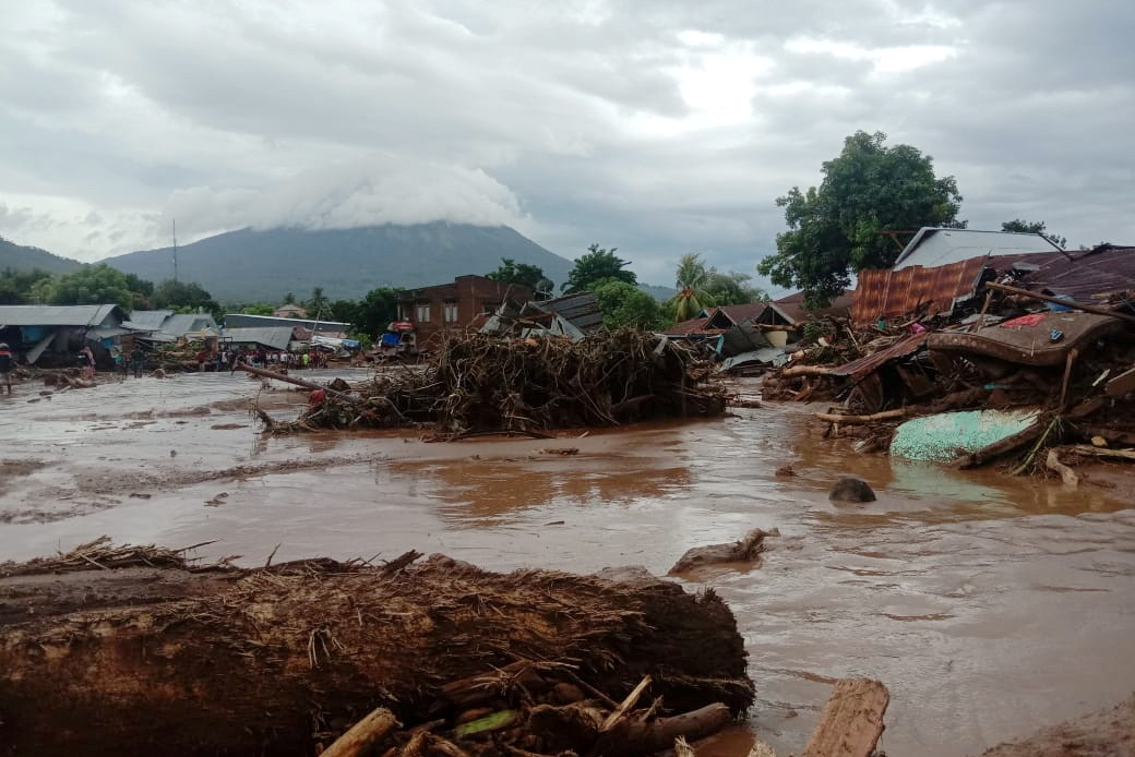 Damaged houses are seen at an area affected by flash floods after heavy rains in East Flores, East Nusa Tenggara province, Indonesia April 4, 2021 in this photo distributed by Antara Foto. Picture taken April 4, 2021. Antara Foto