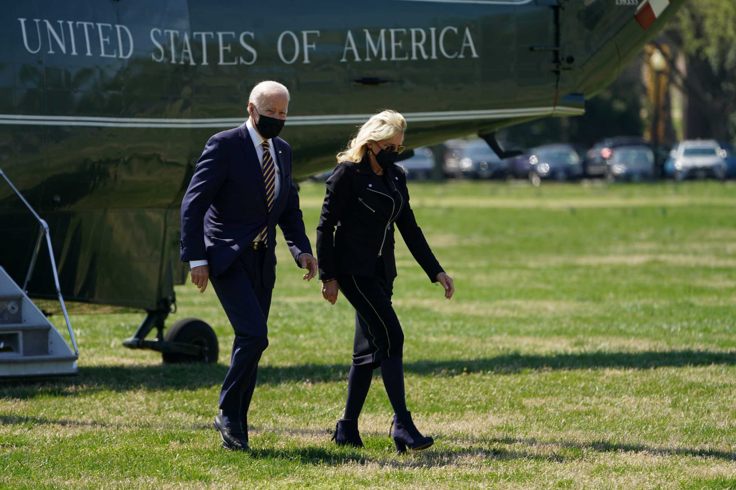 U.S. President Joe Biden steps from Marine One with the first lady Jill Biden on The Ellipse as he returns, after spending Easter weekend at Camp David, to the White House in Washington, U.S., April 5, 2021. REUTERS