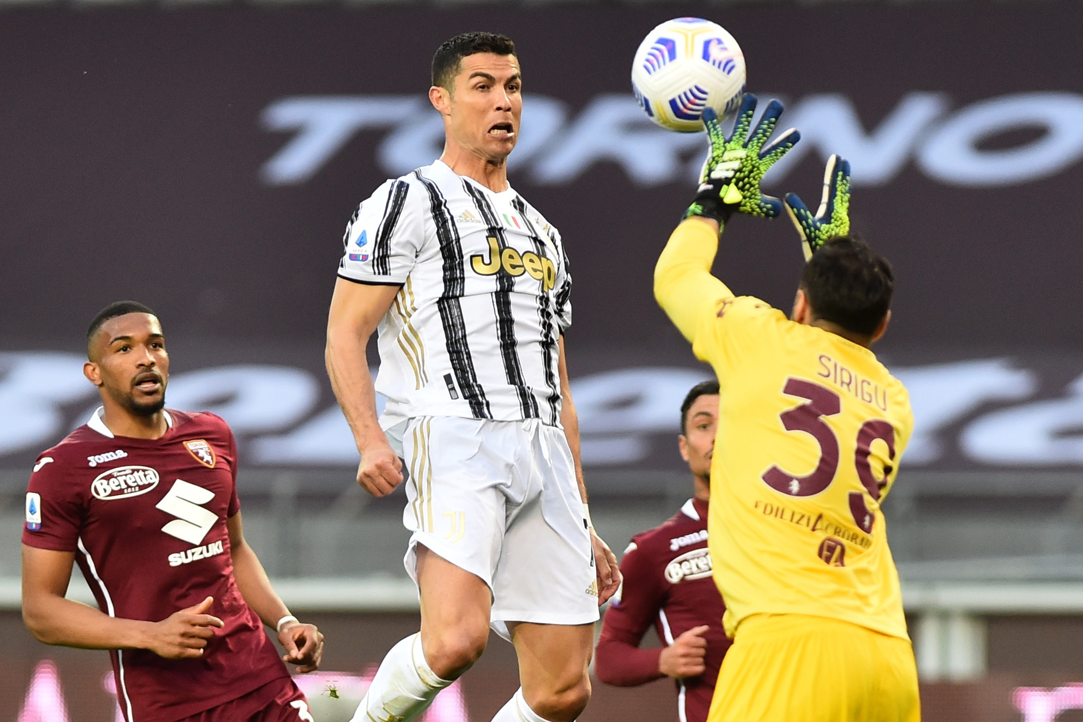Soccer Football - Serie A - Torino v Juventus - Stadio Olimpico Grande Torino, Turin Italy - April 3, 2021 Juventus' Cristiano Ronaldo in action with Torino's Salvatore Sirigu REUTERS
