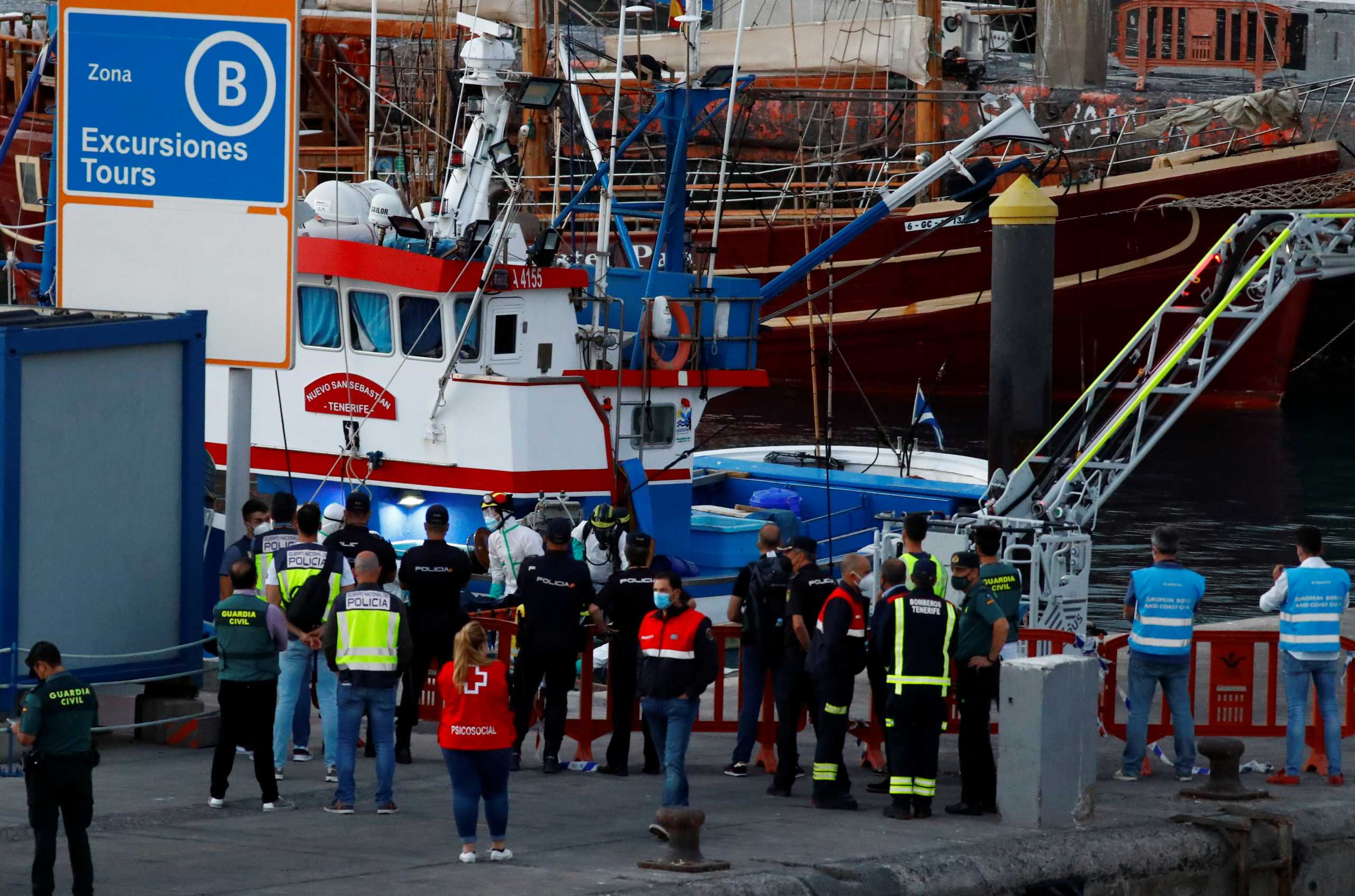 Rescuers from the Spanish Coast Guard tow a boat with the bodies of migrants who were found dead, in the Port of Los Cristianos in the south of the Canary Island of Tenerife, Spain April 28, 2021. REUTERS