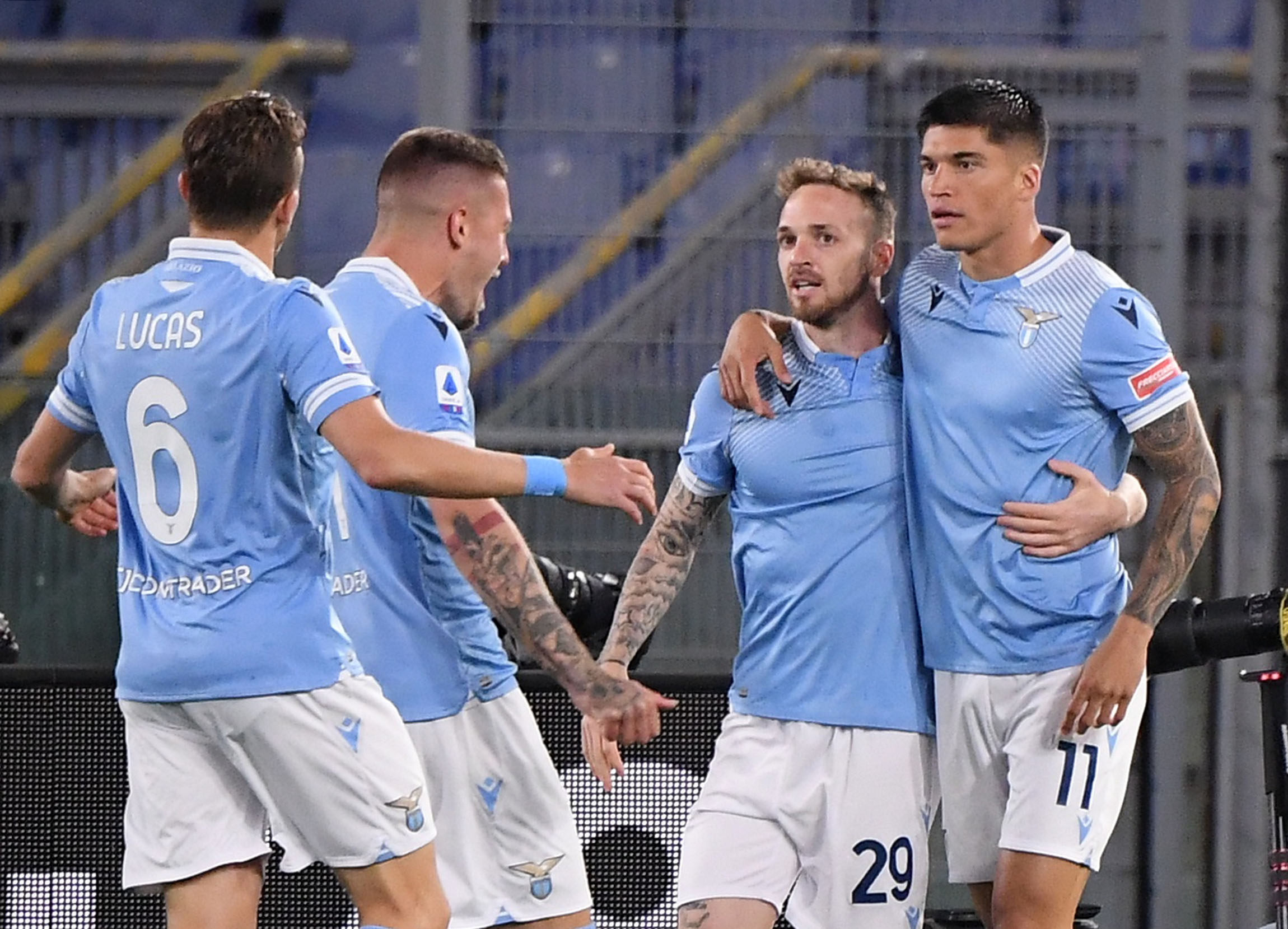 Soccer Football - Serie A - Lazio v AC Milan - Stadio Olimpico, Rome, Italy - April 26, 2021 Lazio's Joaquin Correa celebrates scoring their first goal with teammates REUTERS