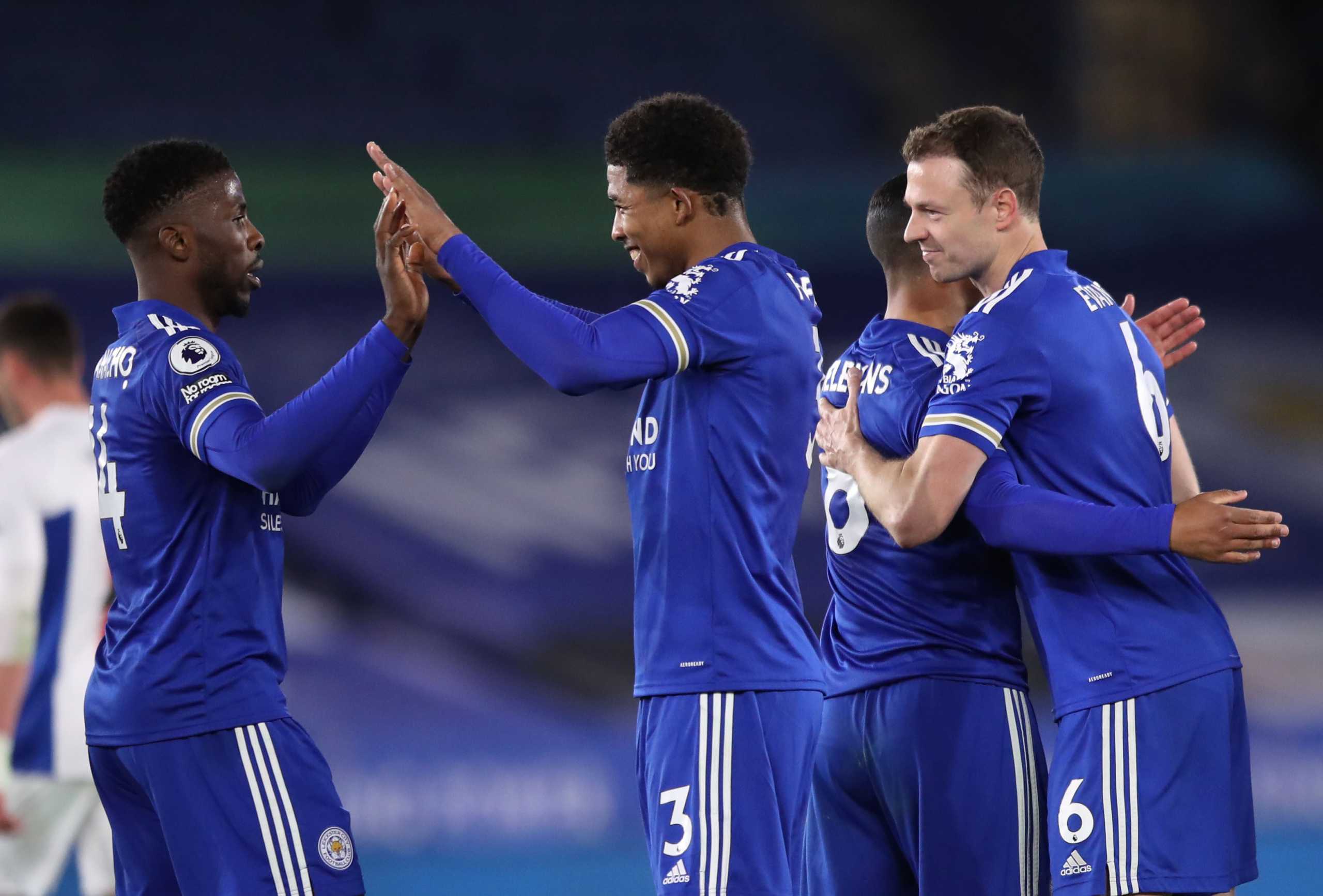 Soccer Football - Premier League - Leicester City v Crystal Palace - King Power Stadium, Leicester, Britain - April 26, 2021 Leicester City's Jonny Evans celebrates with teammates after the match Pool via REUTERS