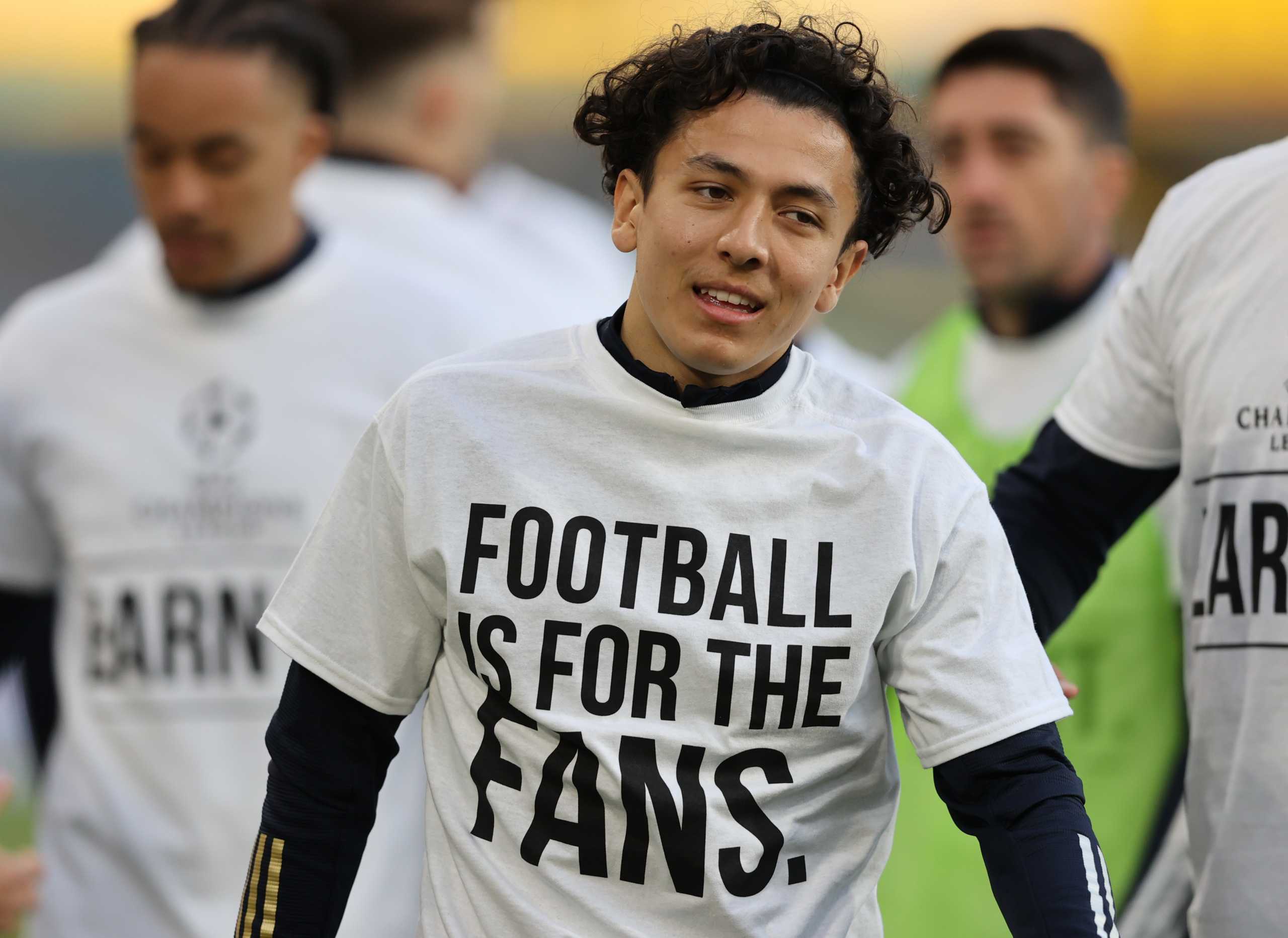 Soccer Football - Premier League - Leeds United v Liverpool - Elland Road, Leeds, Britain - April 19, 2021 Leeds United's Ian Poveda during the warm up before the match wearing UEFA Champions League T- Shirt with the message saying Football is for the Fans Pool via REUTERS
