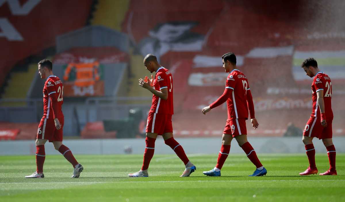 Soccer Football - Premier League - Liverpool v Newcastle United - Anfield, Liverpool, Britain - April 24, 2021 Liverpool's Andrew Robertson, Fabinho, Ozan Kabak and Diogo Jota walk out before the match Pool via REUTERS