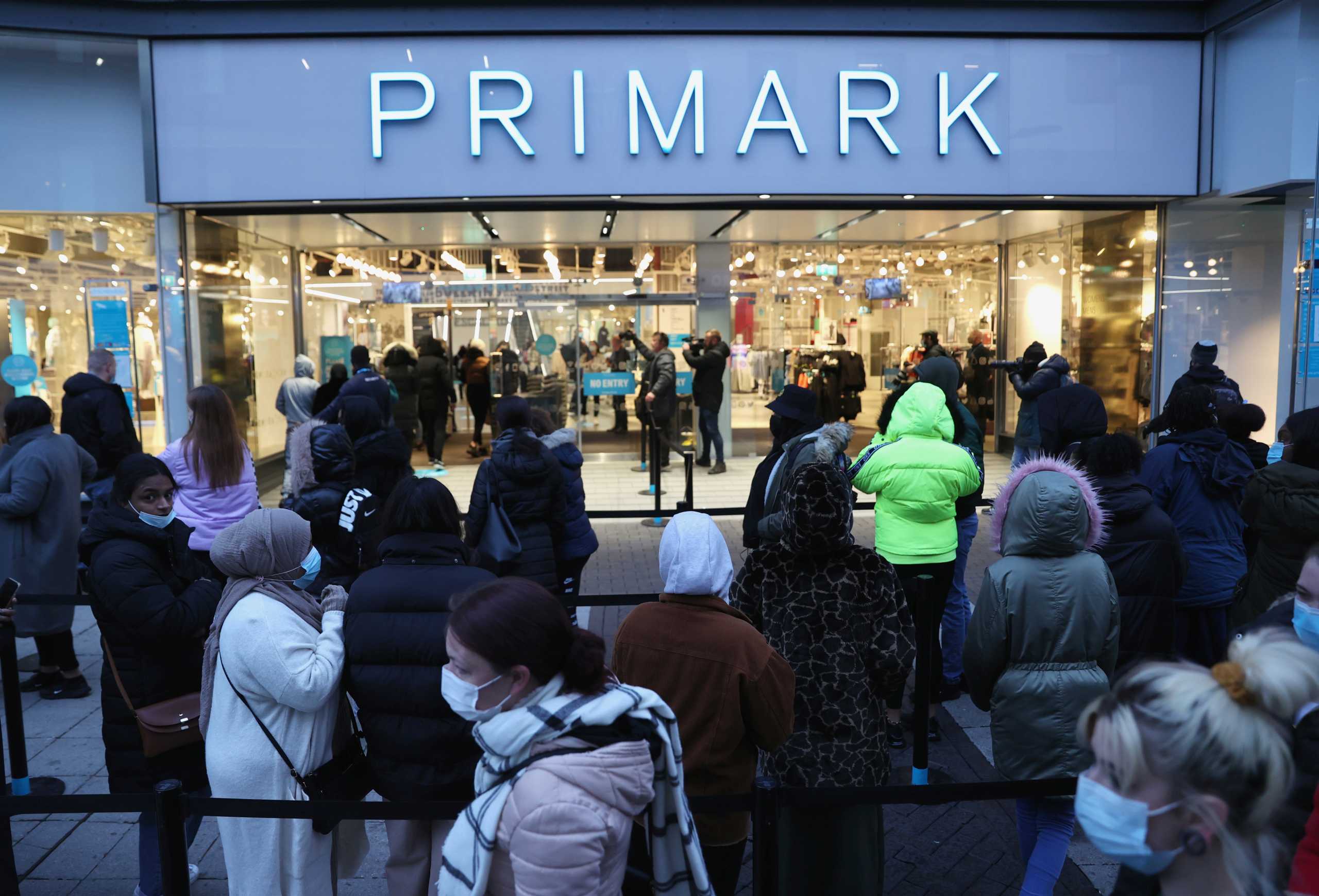Customers wait to enter as retail store Primark in Birmingham, Britain reopens its doors after a third lockdown imposed in early January due to the ongoing coronavirus disease (COVID-19) pandemic, April 12, 2021. REUTERS