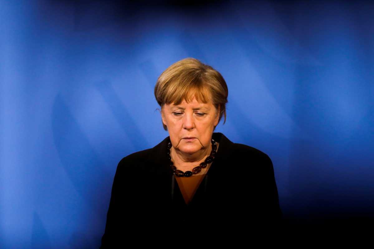 FILE PHOTO: German Chancellor Angela Merkel briefs the media after a virtual meeting with federal state governors at the chancellery in Berlin, Germany, March 30, 2021. Markus Schreiber