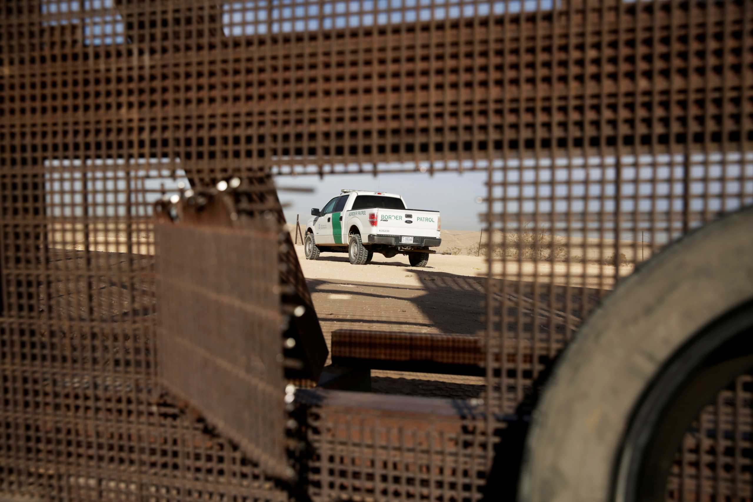 FILE PHOTO: A vehicle of U.S. Border Patrol is seen near the border fence in Sunland Park, New Mexico, U.S., as pictured from the Mexican side of the border in Ciudad Juarez February 12, 2021. REUTERS
