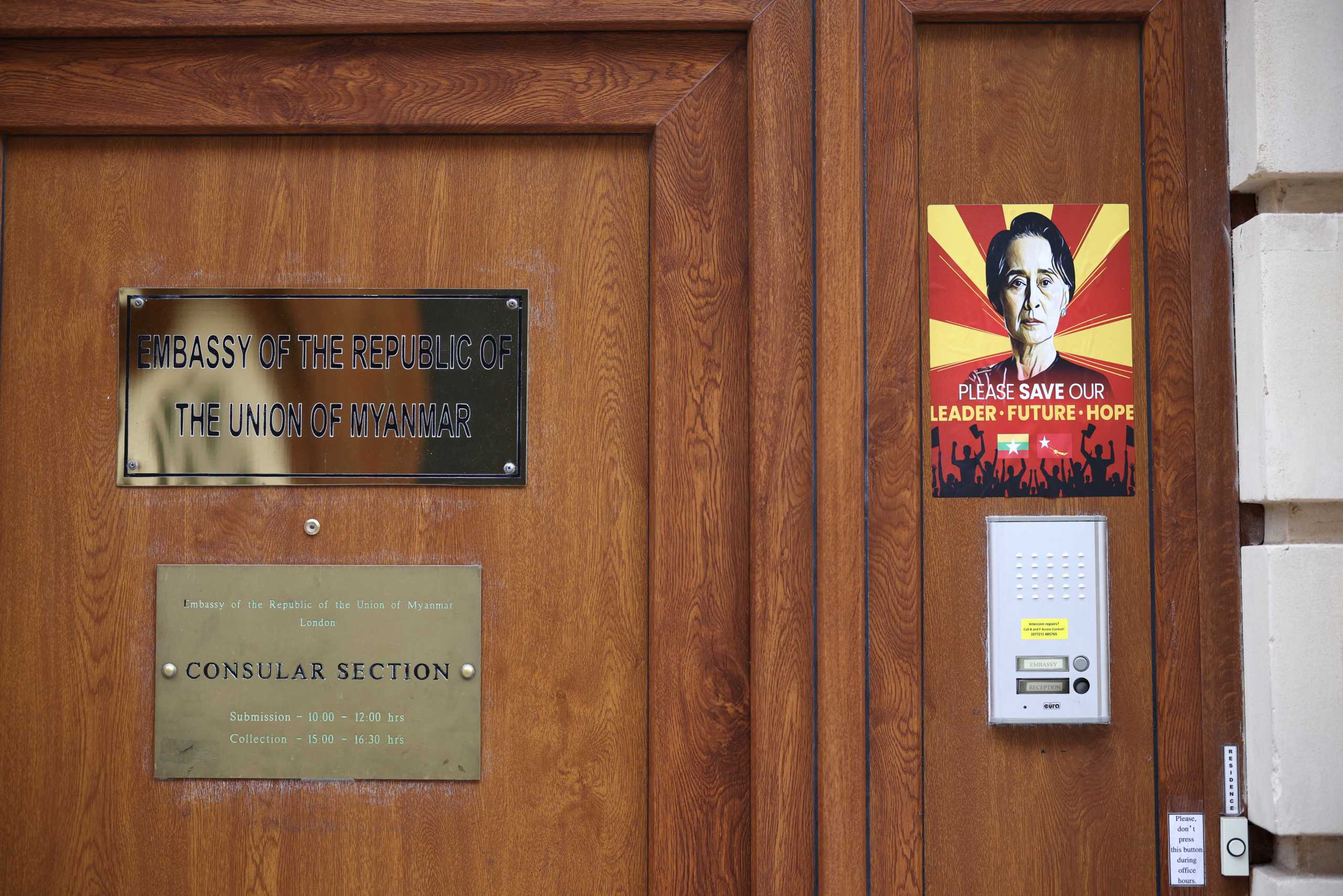 A poster in support of leader Aung San Suu Kyi is seen outside the Embassy of Myanmar, in London, Britain, March 28, 2021. REUTERS