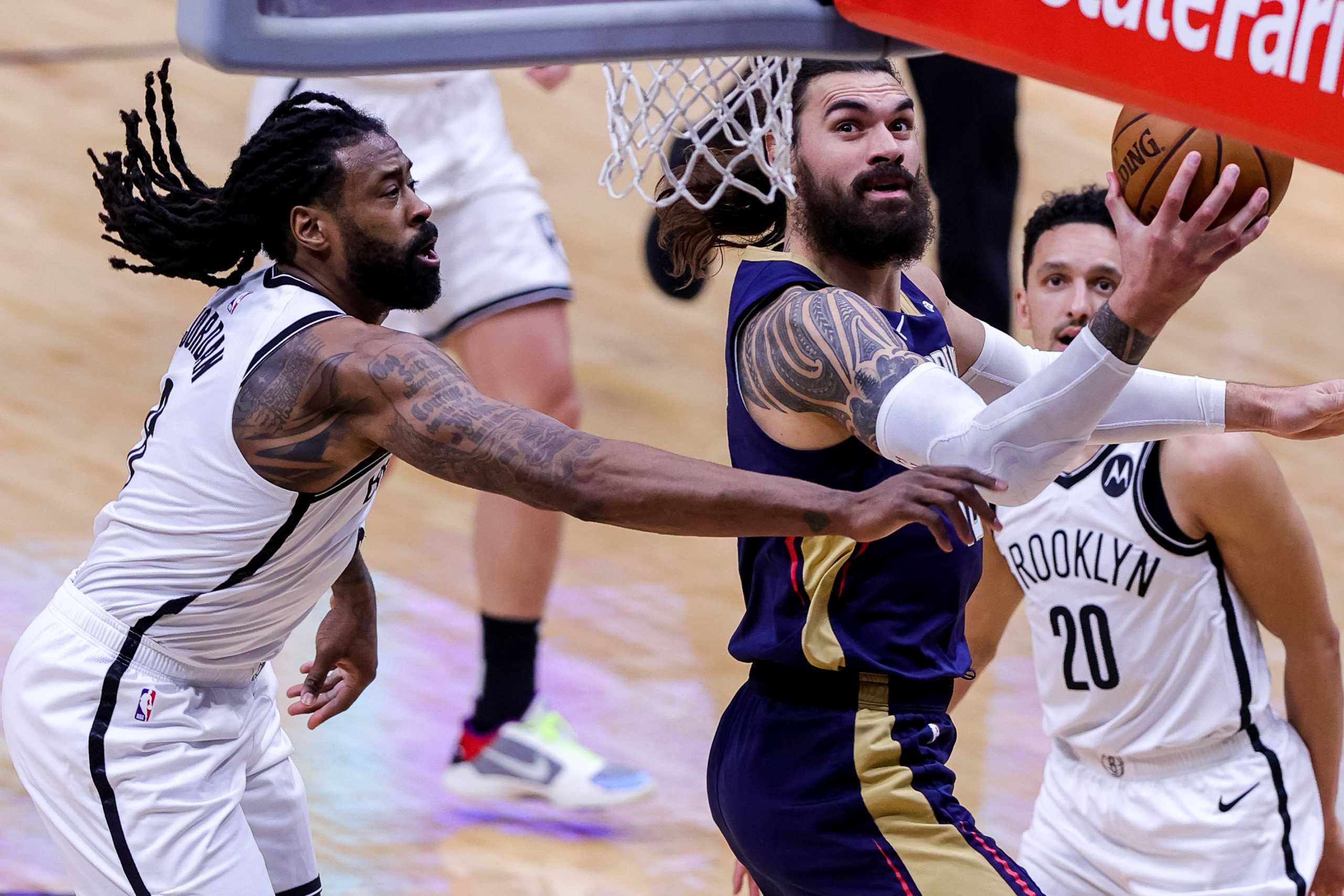 Apr 20, 2021; New Orleans, Louisiana, USA;  New Orleans Pelicans center Steven Adams (12) drives to the basket against Brooklyn Nets center DeAndre Jordan (6) during the second half at the Smoothie King Center. Mandatory Credit: Stephen Lew-USA TODAY Sports
