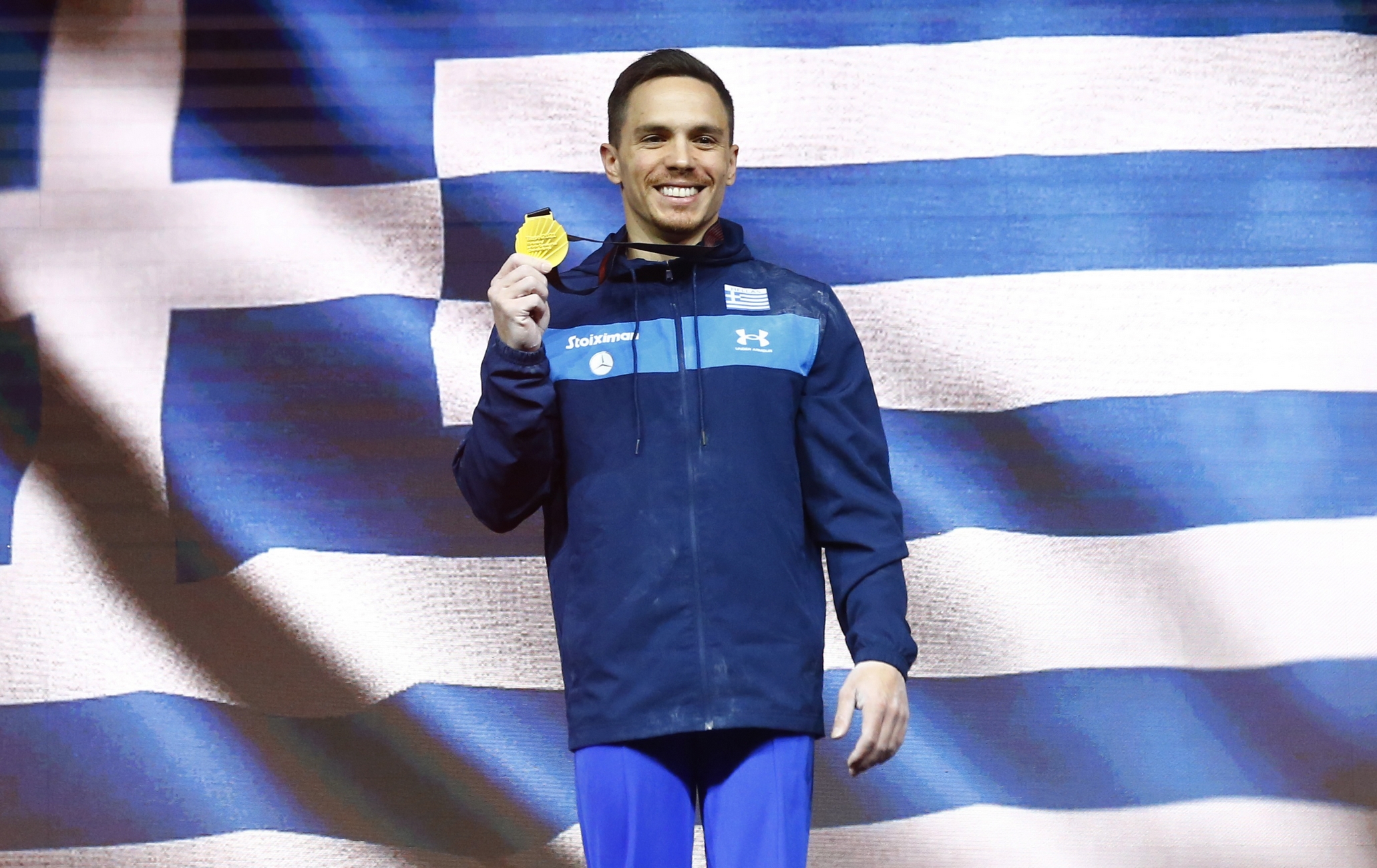 Gymnastics - 2021 European Artistic Gymnastics Championships - St. Jakobshalle, Basel, Switzerland - April 24, 2021 Greece’s Eleftherios Petrounias celebrates on the podium with his gold medal after winning the men’s all-round final rings REUTERS