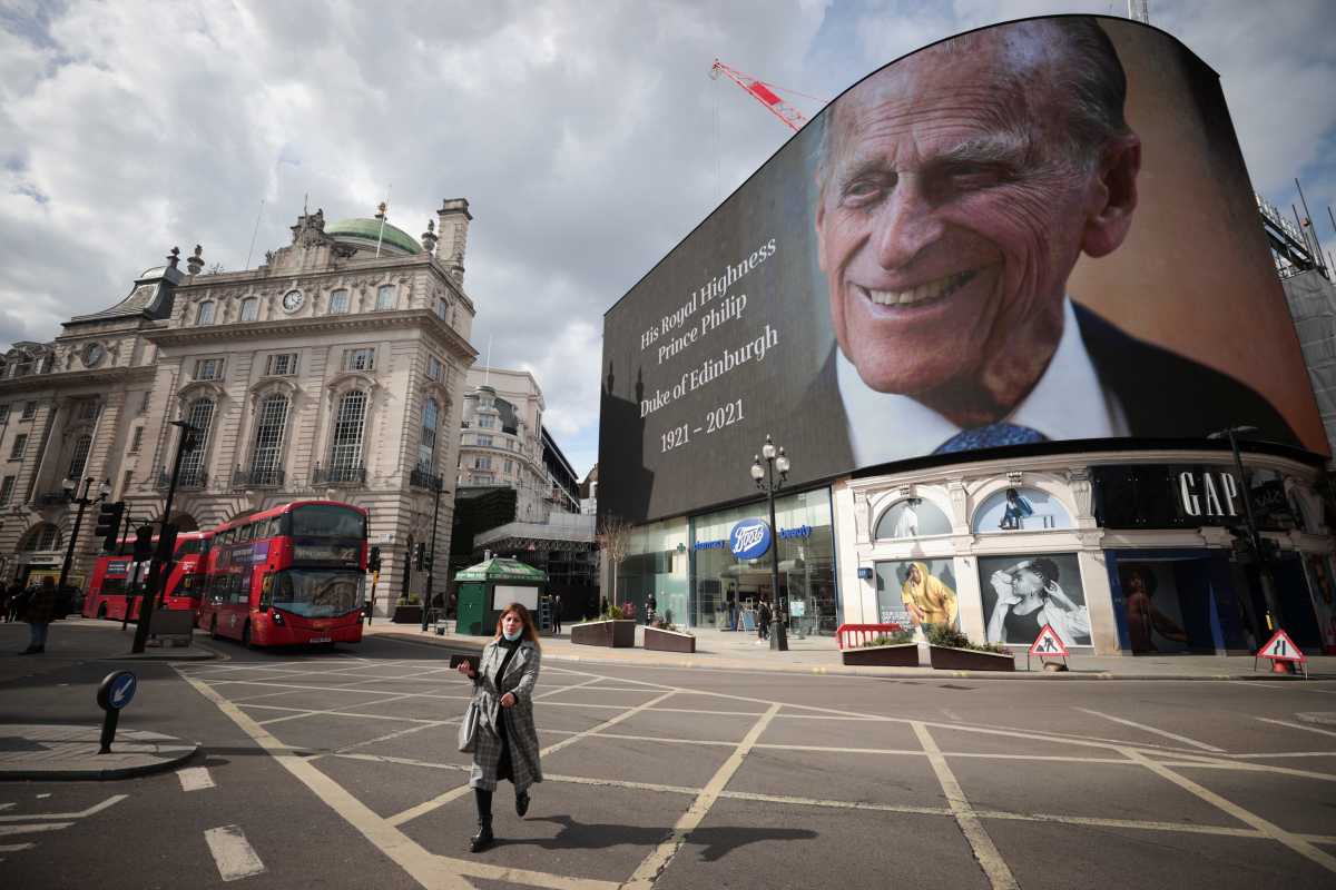 A screen with a picture and a message about Britain's Prince Philip, husband of Queen Elizabeth, is seen at Piccadilly Circus after he died at the age of 99, in London, Britain, April 9, 2021. REUTERS