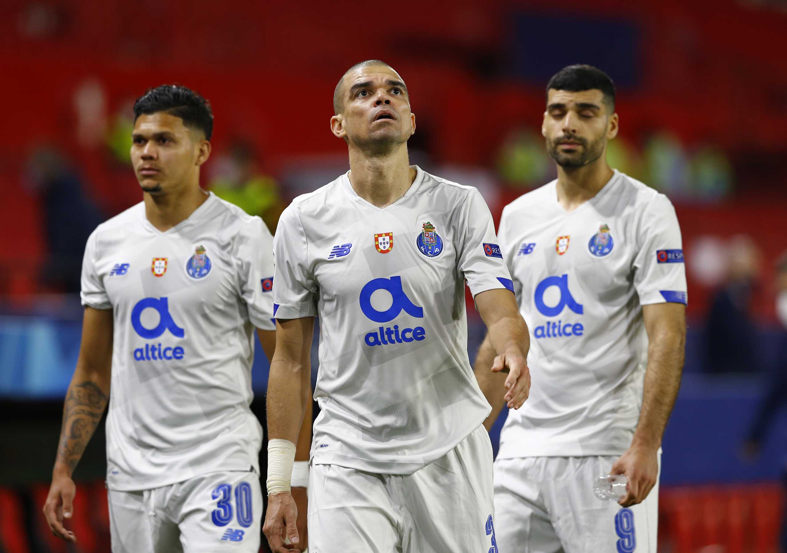 Soccer Football - Champions League - Quarter Final Second Leg - Chelsea v Porto - Ramon Sanchez Pizjuan, Seville, Spain - April 13, 2021 FC Porto's Evanilson, Pepe and  Mehdi Taremi looks dejected after the match REUTERS