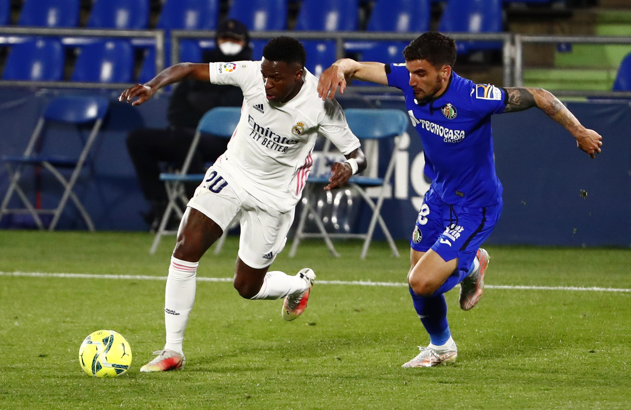 Soccer Football - La Liga Santander - Getafe v Real Madrid - Coliseum Alfonso Perez, Getafe, Spain - April 18, 2021 Getafe's Mauro Arambarri in action with Real Madrid's Vinicius Junior REUTERS