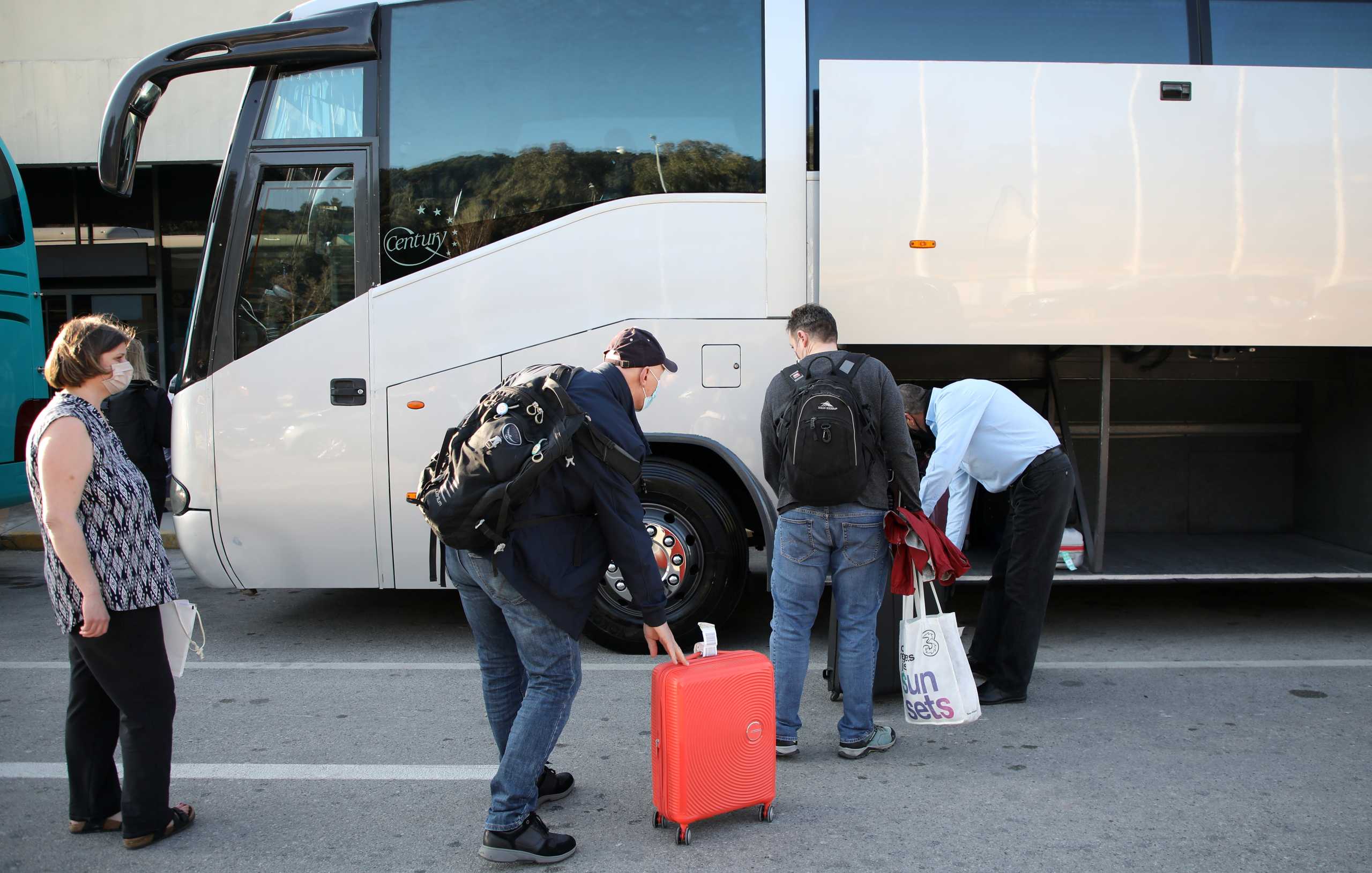 Dutch tourists, who will spend a week long holiday in isolation in their tourist resort as part of an experiment, arrive at the Rhodes International Airport, amid the coronavirus disease (COVID-19) outbreak on the island of Rhodes, Greece April 12, 2021. REUTERS