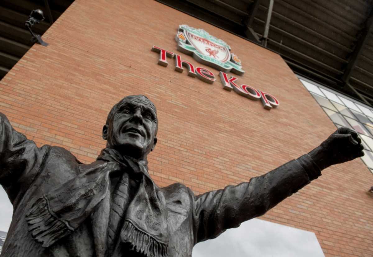 epa08295215 A general view of the statue of Bill Shankly which is placed outside KOP stand at Liverpool FC stadium at Anfield, Liverpool, Britain, 14 March 2020. This is a general view of the Main stand at Liverpool FC Stadium, at Anfield, Liverpool, Britain, 14 March 2020.  EPA