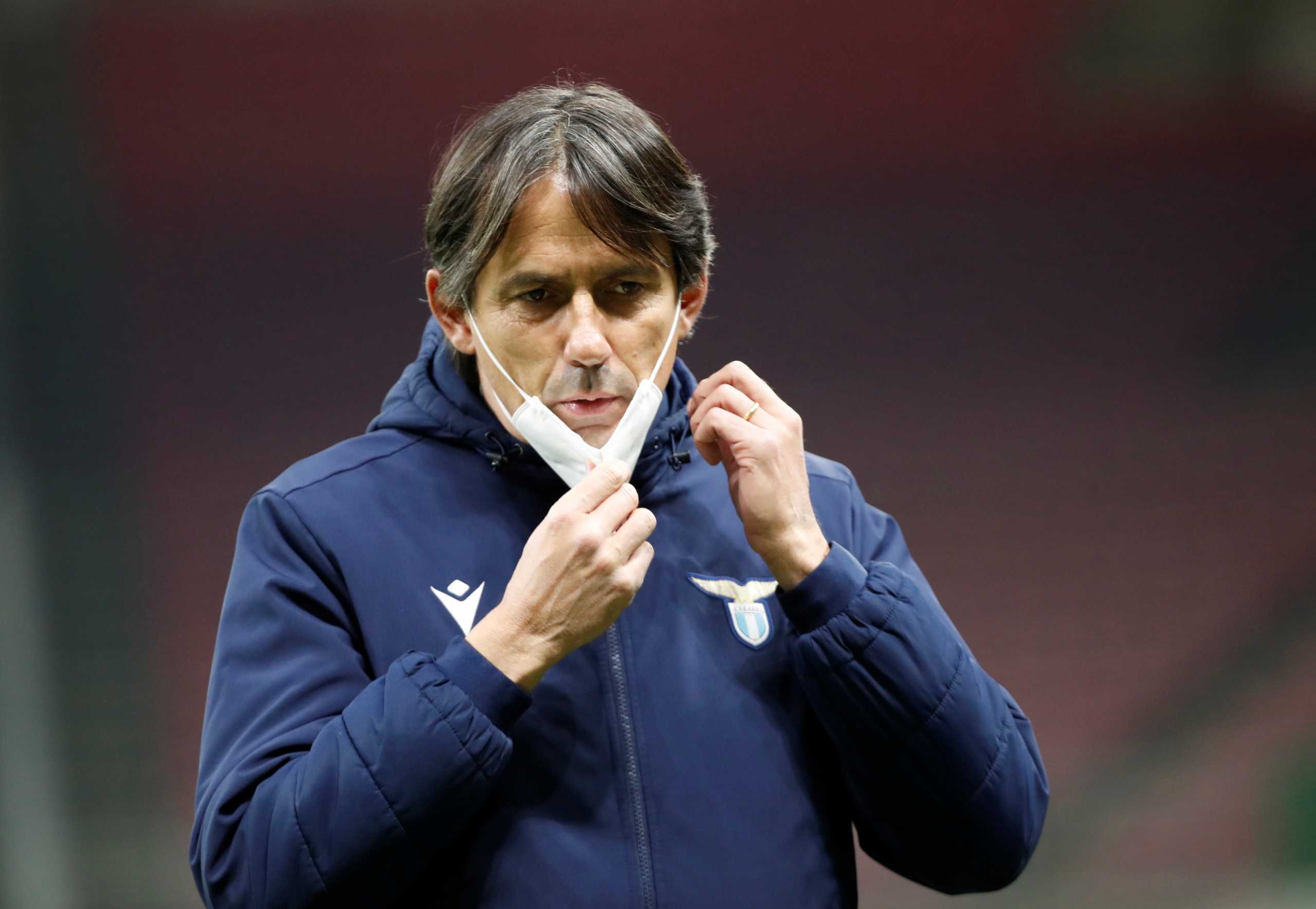 FILE PHOTO: Soccer Football - Serie A - Inter Milan v Lazio - San Siro, Milan, Italy - February 14, 2021 Lazio coach Simone Inzaghi wearing a mask before the match REUTERS