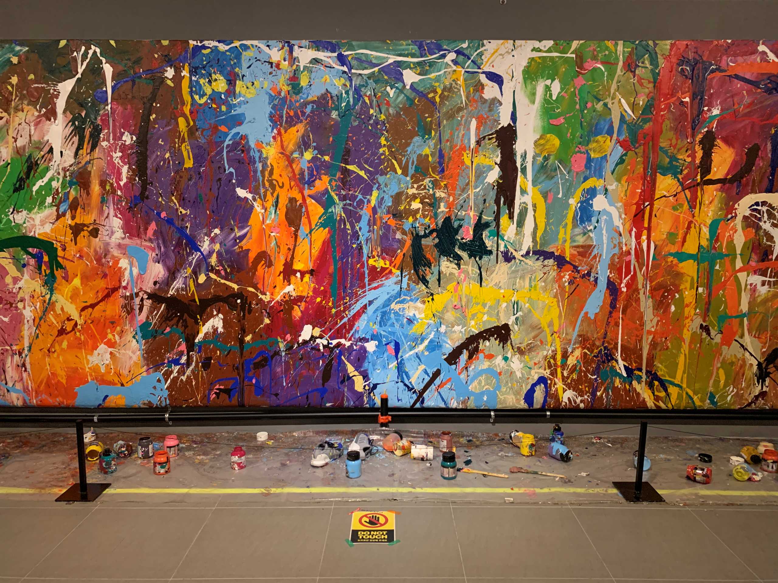 The marks painted by a young couple are seen on the graffiti artwork of New York-based artist Jon One at a gallery in Seoul, South Korea April 2, 2021. REUTERS